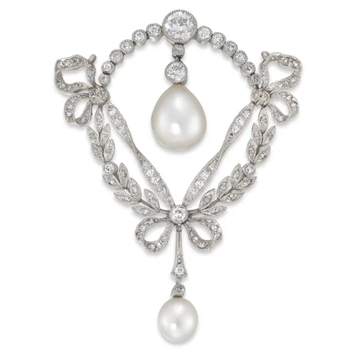 An Edwardian Classic: Pendant/brooch on white gold, pearls and diamonds available to purchase at Bentley and Skinner.