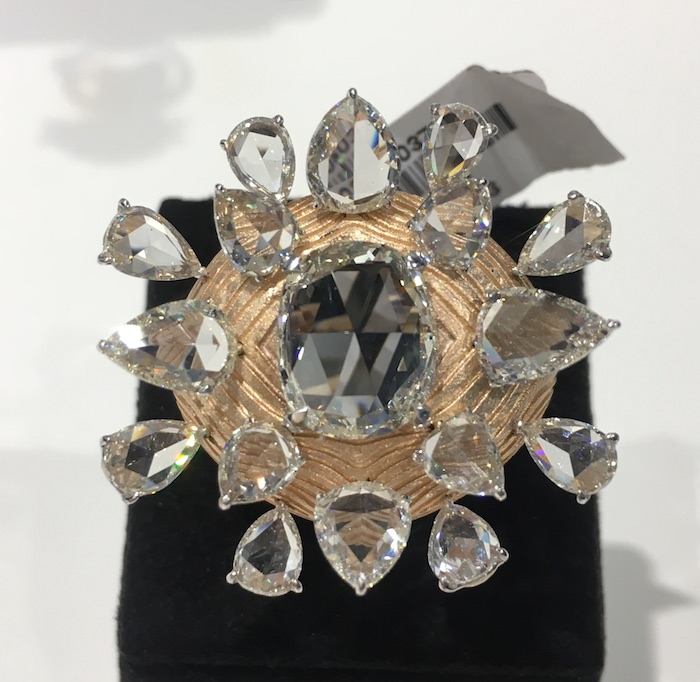 Textured rose gold and rose cut diamonds are artfully put together in this ring by VAK.