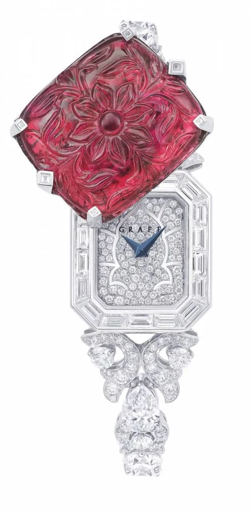An exceptional carved ruby and diamond watch by Graff.