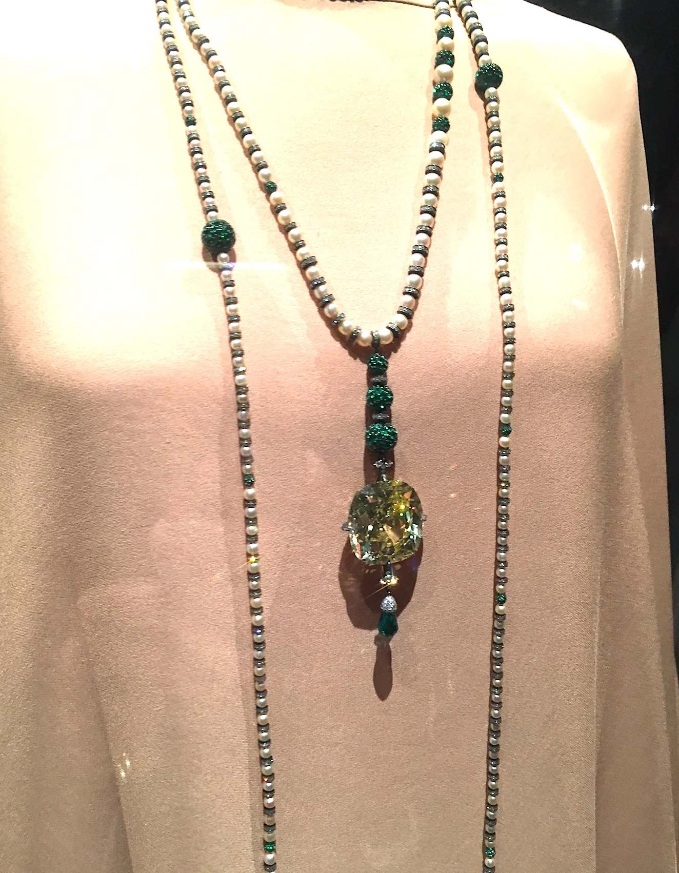A stunning necklace by JAR featuring the largest certified old-cut cushion cut fancy vivid yellow diamond in the world. It weighs 114.65 carats.