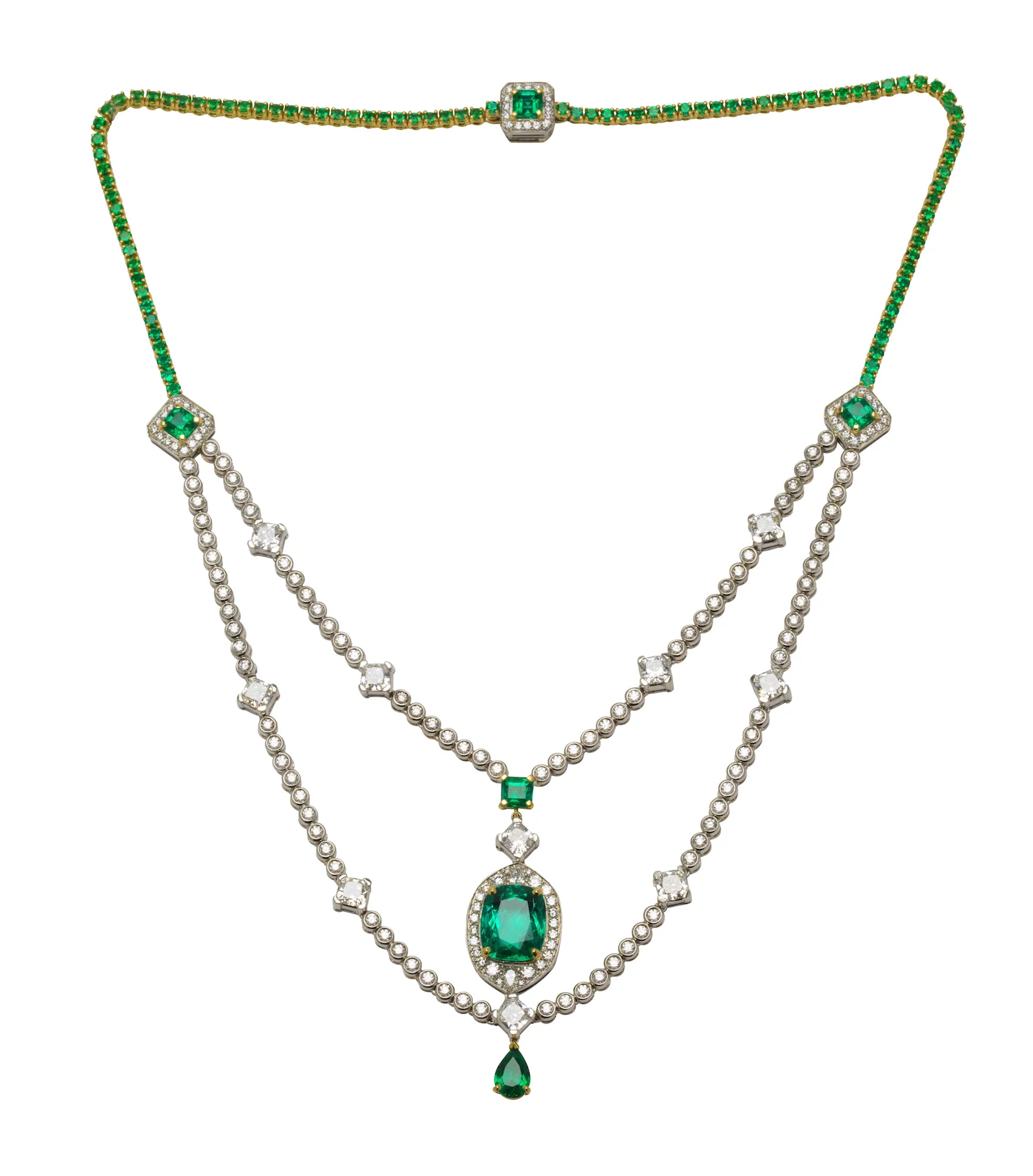 An emerald and diamond necklace, composed of a double strand of round and cushion cut diamonds; the centre stone an important Colombian cushion cut emerald.