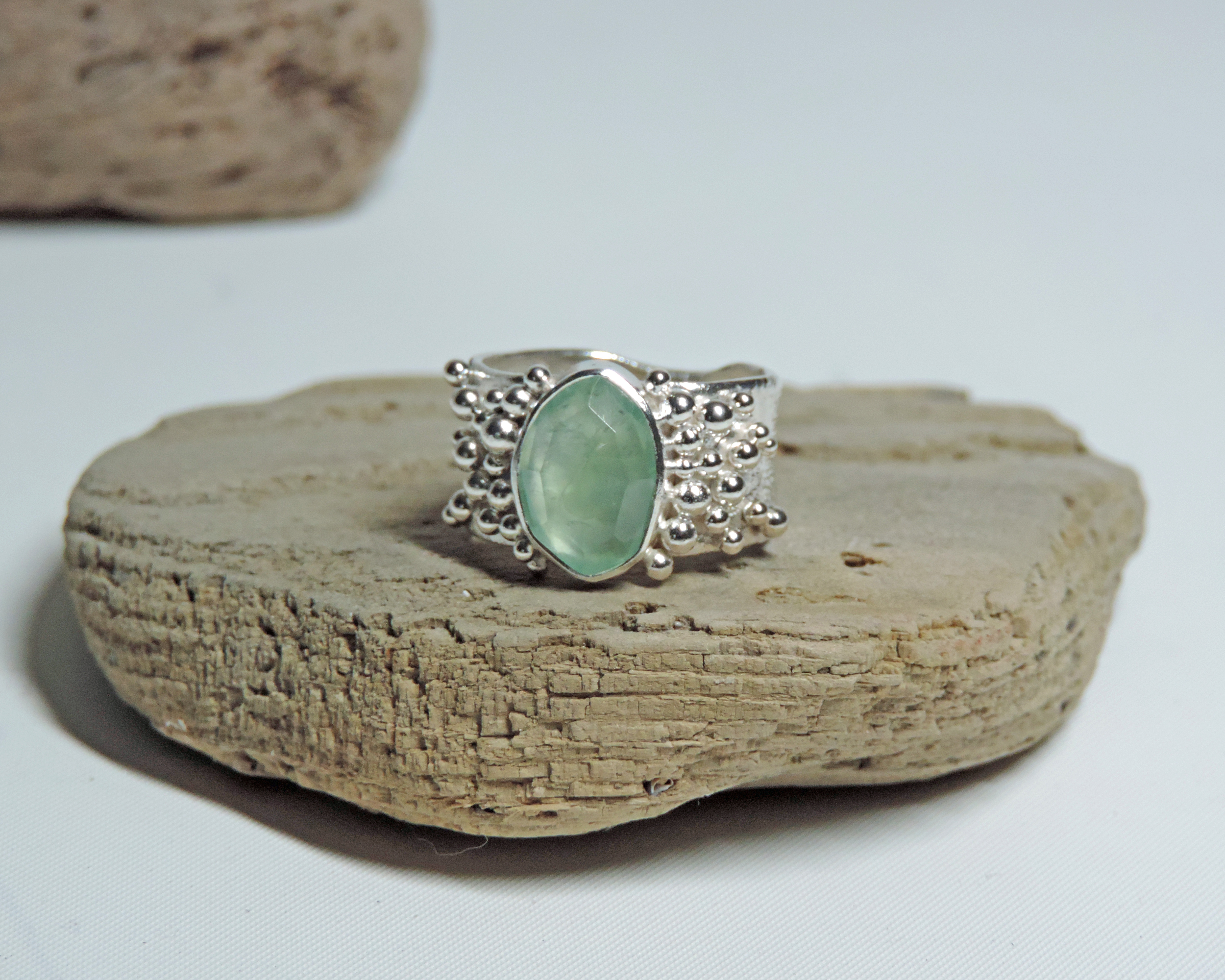 Large silver bauble ring with mint green tourmaline rose cut stone.
