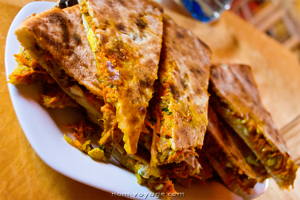 Berber pizza slices. You can't miss this if you're in southern Morocco! Meat, veggies, and spices baked into pizza-style crust. 