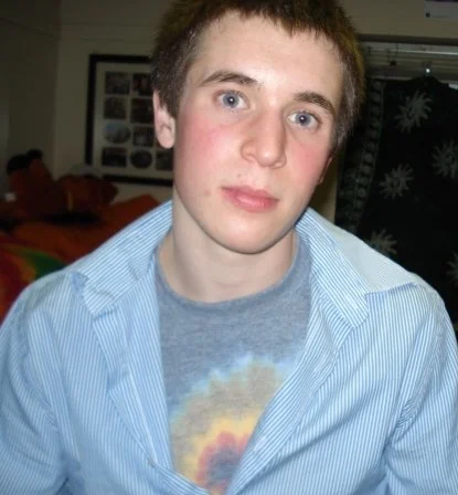 Hanging out in a friend's dorm room during my freshman year of college with a flushed babyface. 2007.