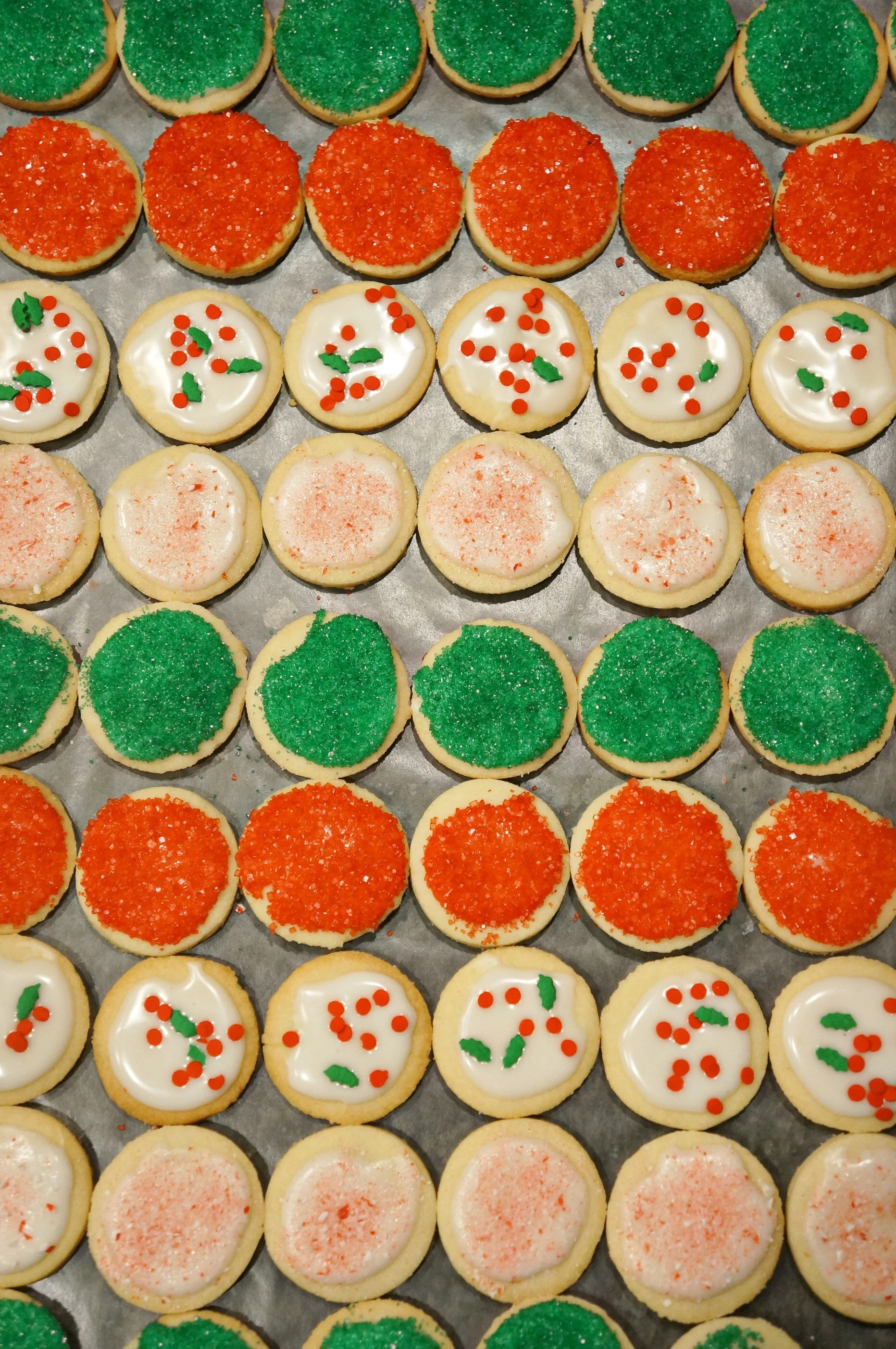 Starting with my cut-out sugar cookies topped with my favorite easy glaze, red sprinkles, green sprinkles, Christmas sprinkles and peppermint crunch. 