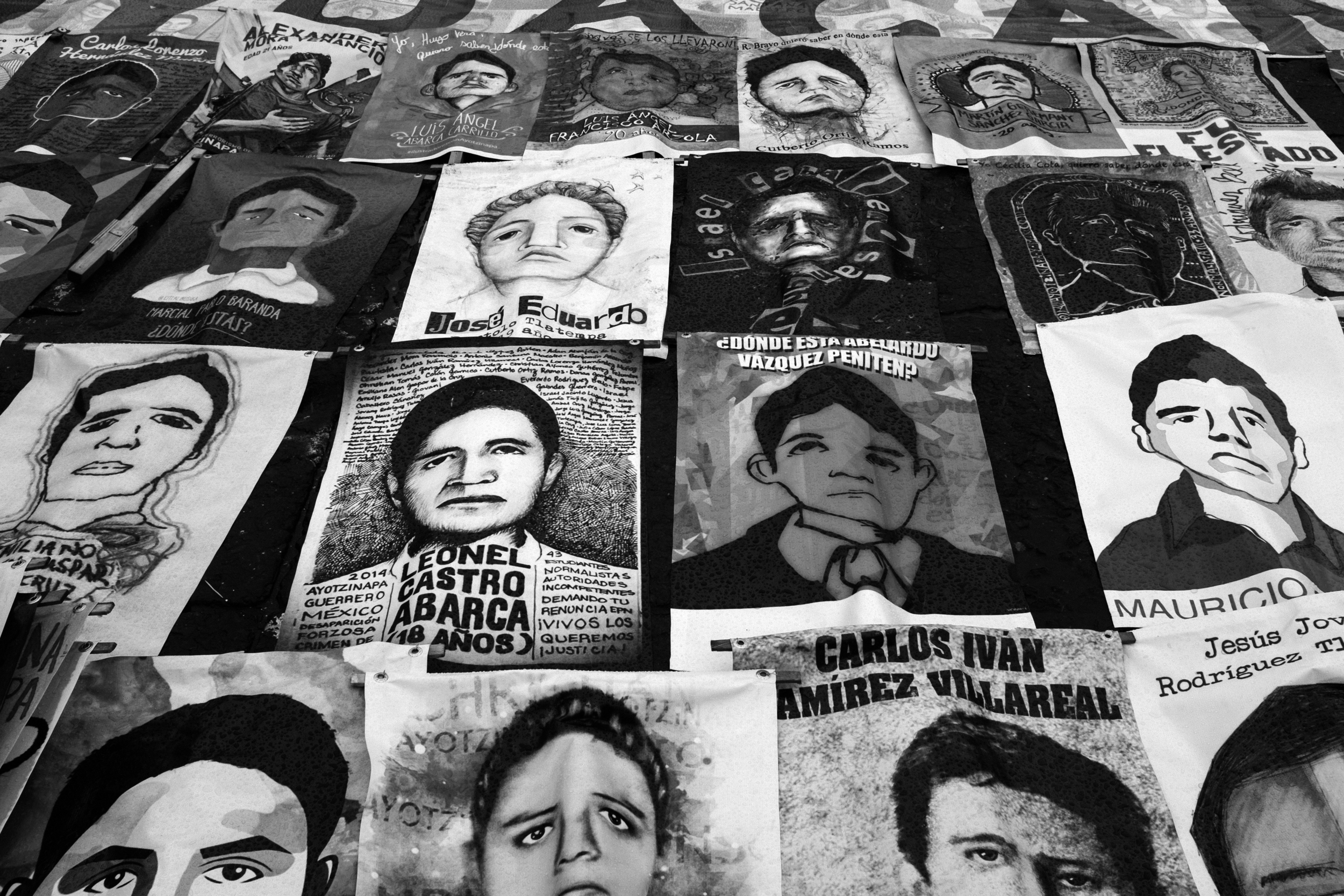 Protesters carried images of each of the 43 teaching students last at a demonstration in Mexico City, Mexico that marked the one-year anniversary of their disappearance. PHOTO CREDIT: MEGHAN DHALIWAL.
