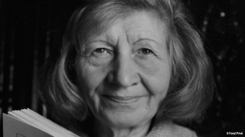 Violette Leduc poses for a photo with her breakout work, La Bâtarde. Photo courtesy of Women Make Movies.