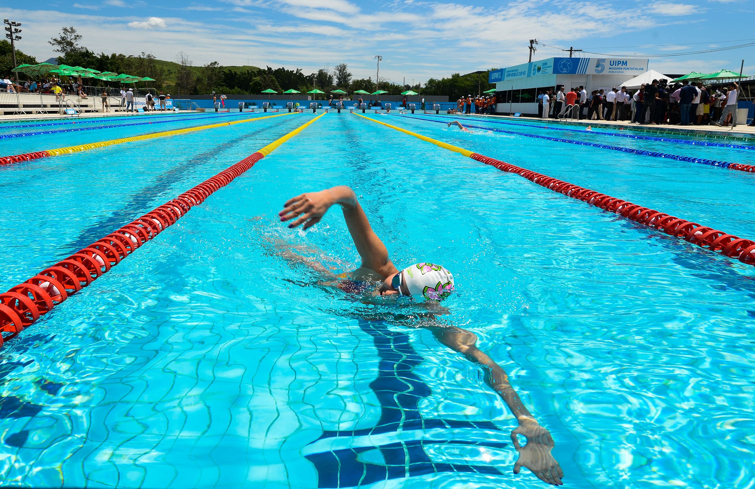 A WOMAN PRACTICES IN THE AQUATICS COMPOUND IN RIO AHEAD OF THE 2016 OLYMPIC GAMES. IMAGE BY TÂNIA RÊGO/AGÊNCIA BRASIL VIA WIKIMEDIA COMMONS.