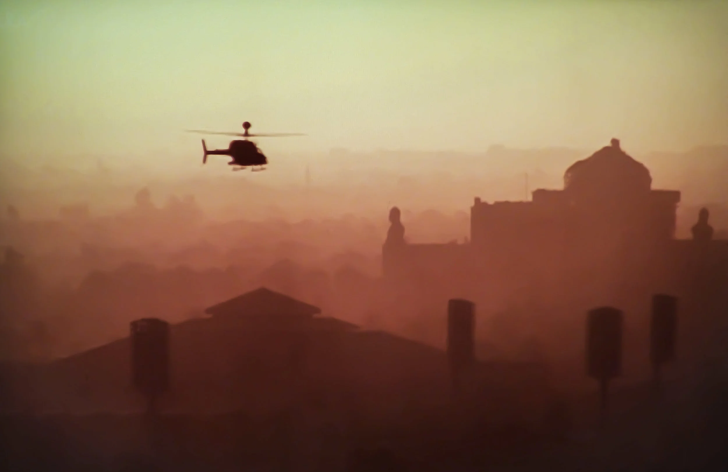 A SURVEILLANCE HELICOPTER FLIES OVER BAGHDAD. PHOTO BY RLD73 VIA FLICKR. 