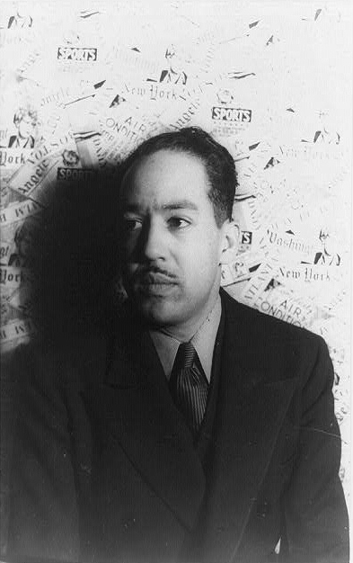 LANGSTON HUGHES SITS FOR A PORTRAIT BY CARL VAN VECHTEN IN 1936. IMAGE VIA WIKIMEDIA COMMONS.