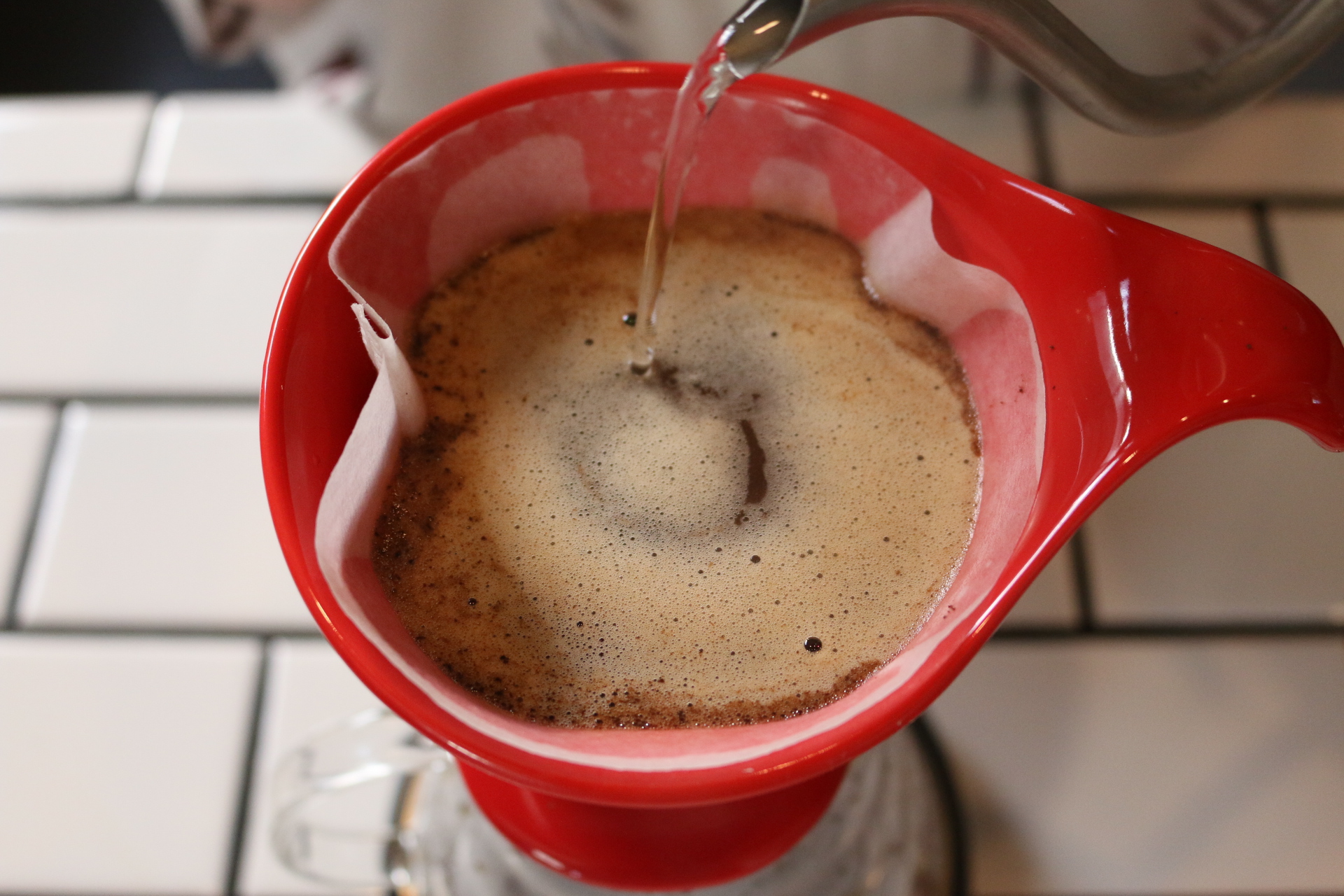 6. Slowly add more water, pouring with your kettle in a small, circular pattern.