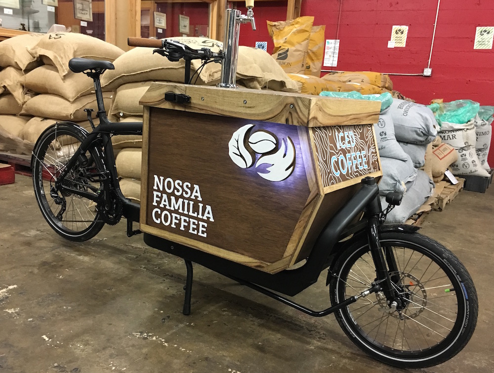 Nossa Familia Coffee's New Iced Coffee Cargo Bike with kegs on tap