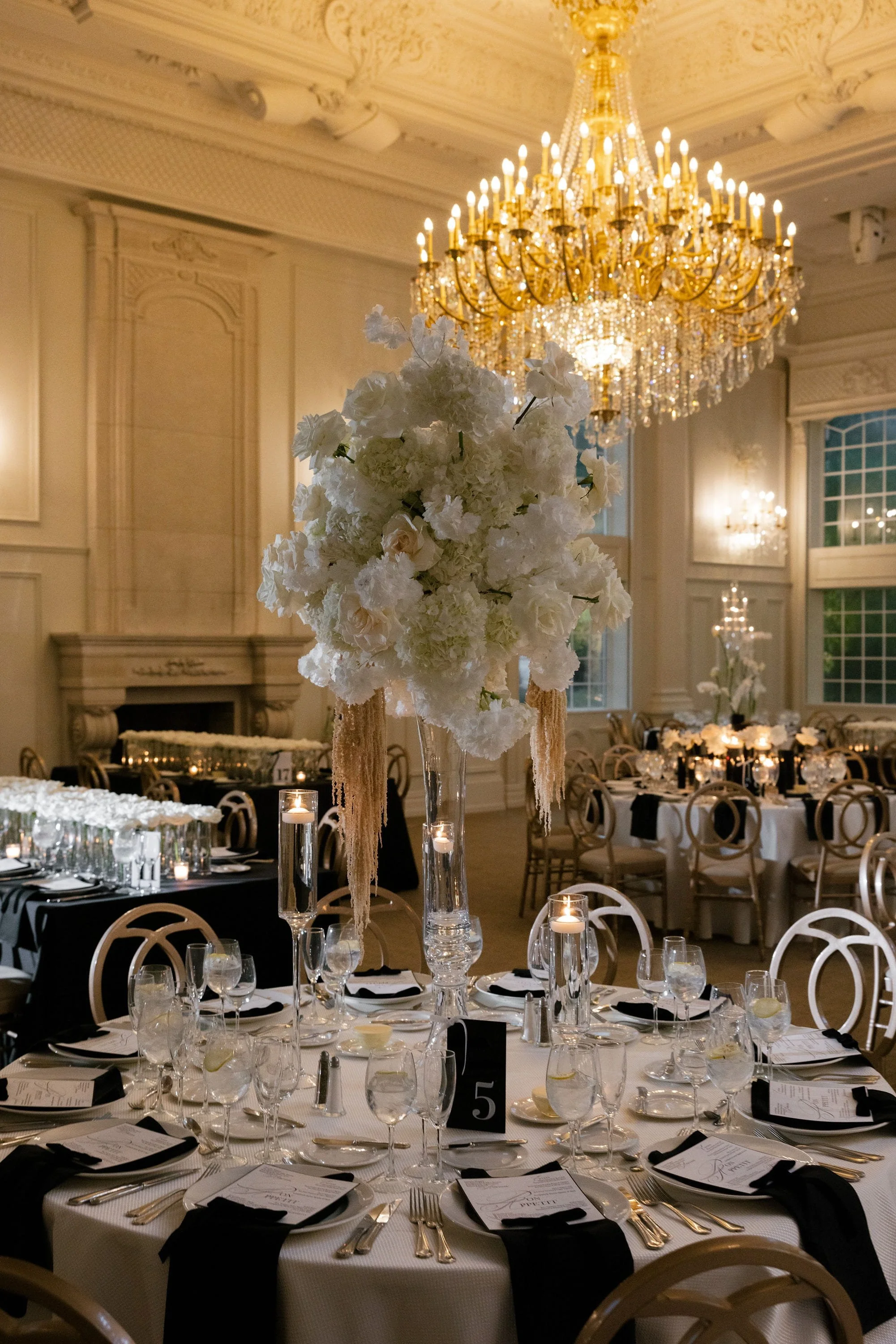 Elegant reception tablescape at Florentine Gardens with white florals, candles and gold accents