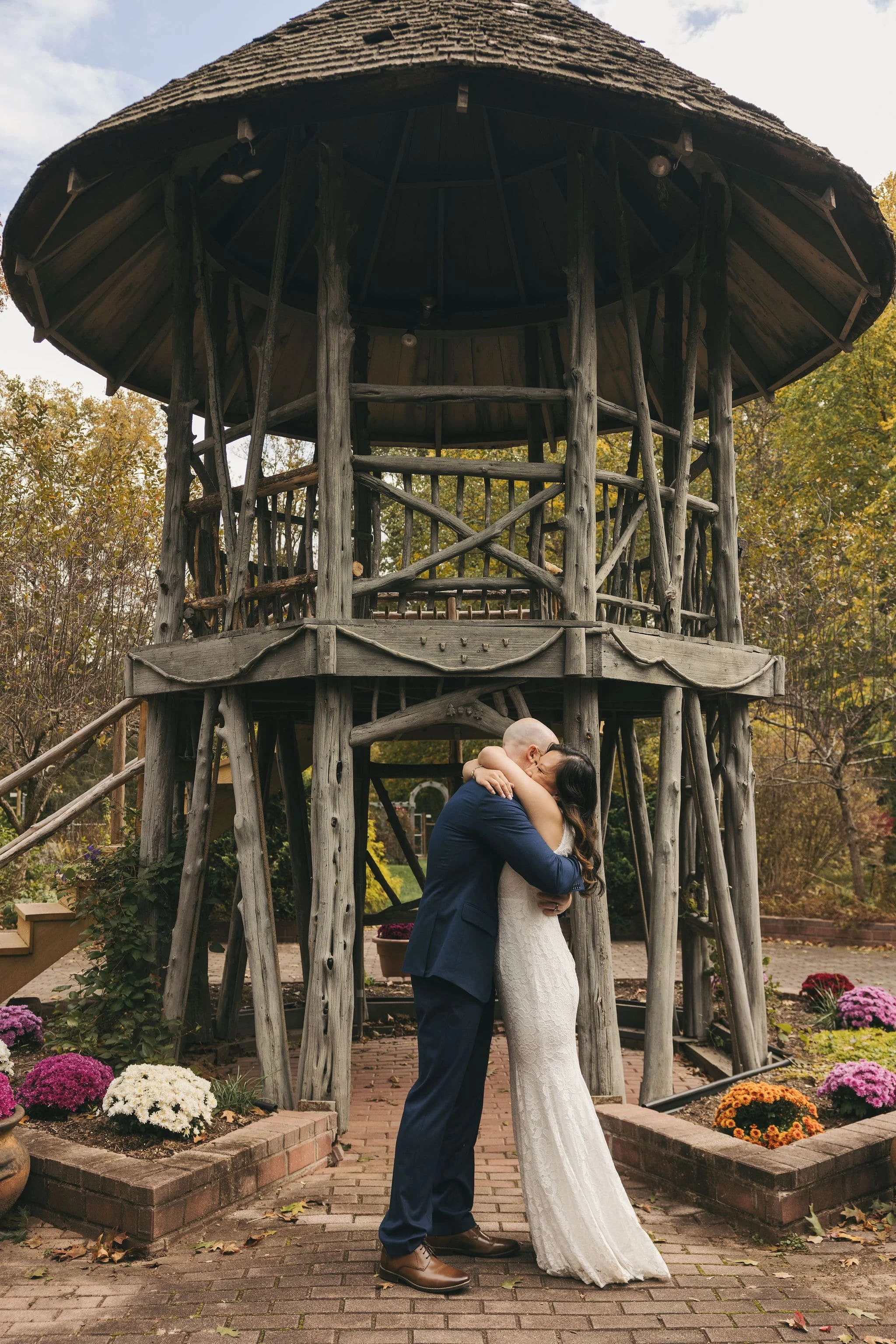 Newlywed couple embracing after their intimate elopement ceremony at Hunterdon Arboretum in Lebanon, New Jersey.