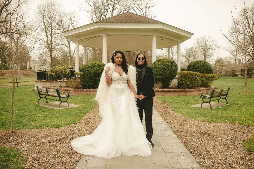 Tiffany and Ro in front of the white gazebo at Mindowaskin Park in Westfield, NJ