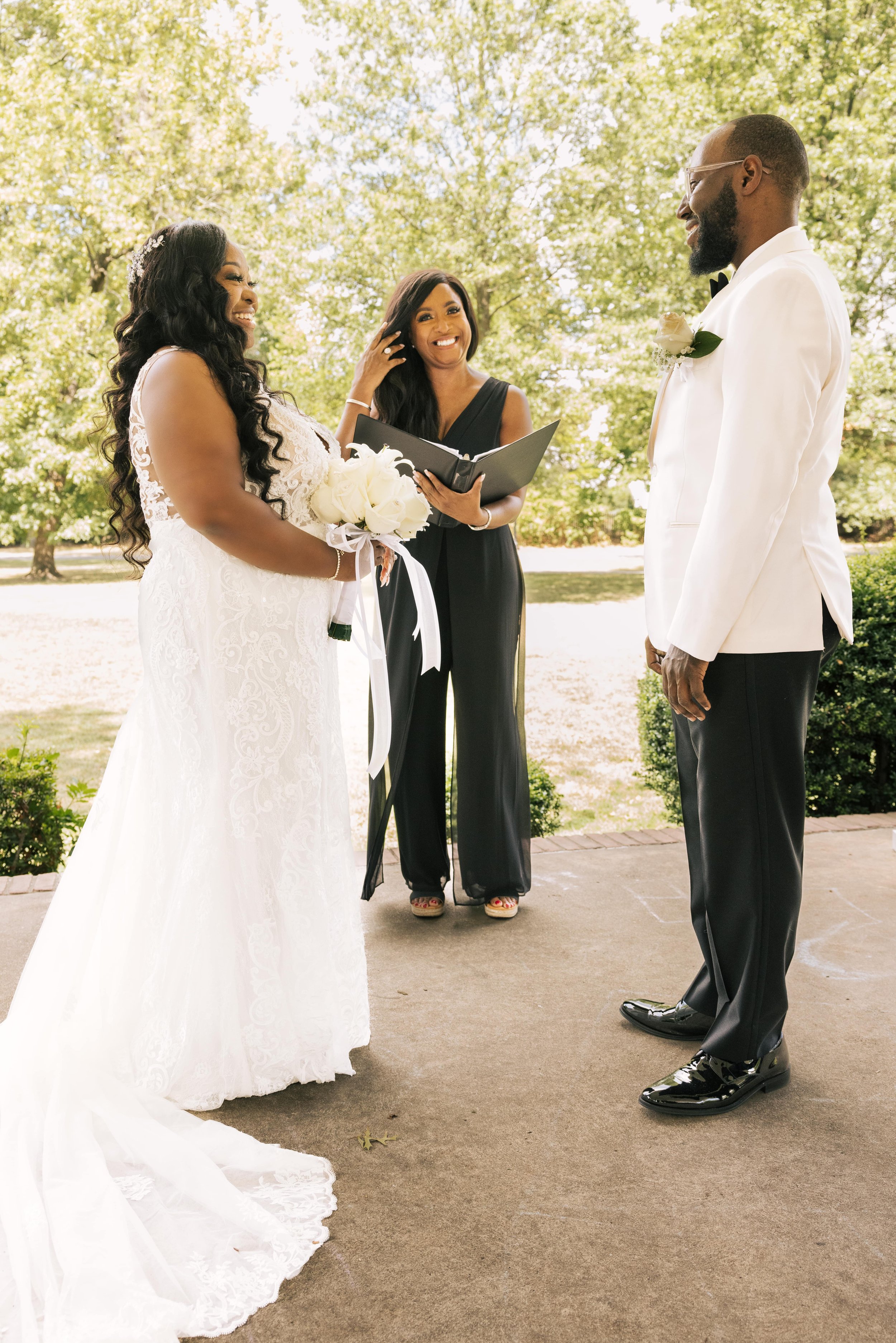 Two brides exchange vows during an intimate elopement ceremony in New Jersey officiated by Weddings By Aretha.