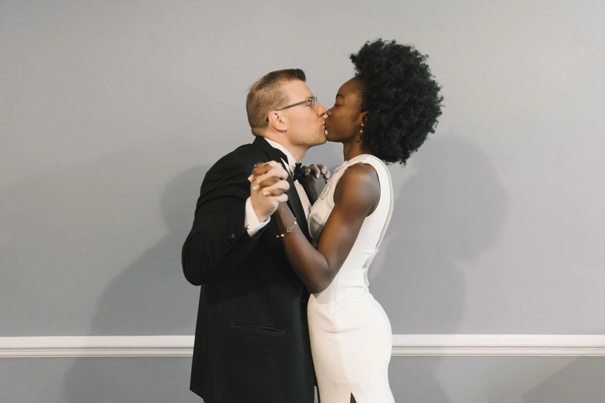 Couple sharing a quiet moment during an intimate indoor elopement ceremony in Bergen County, New Jersey