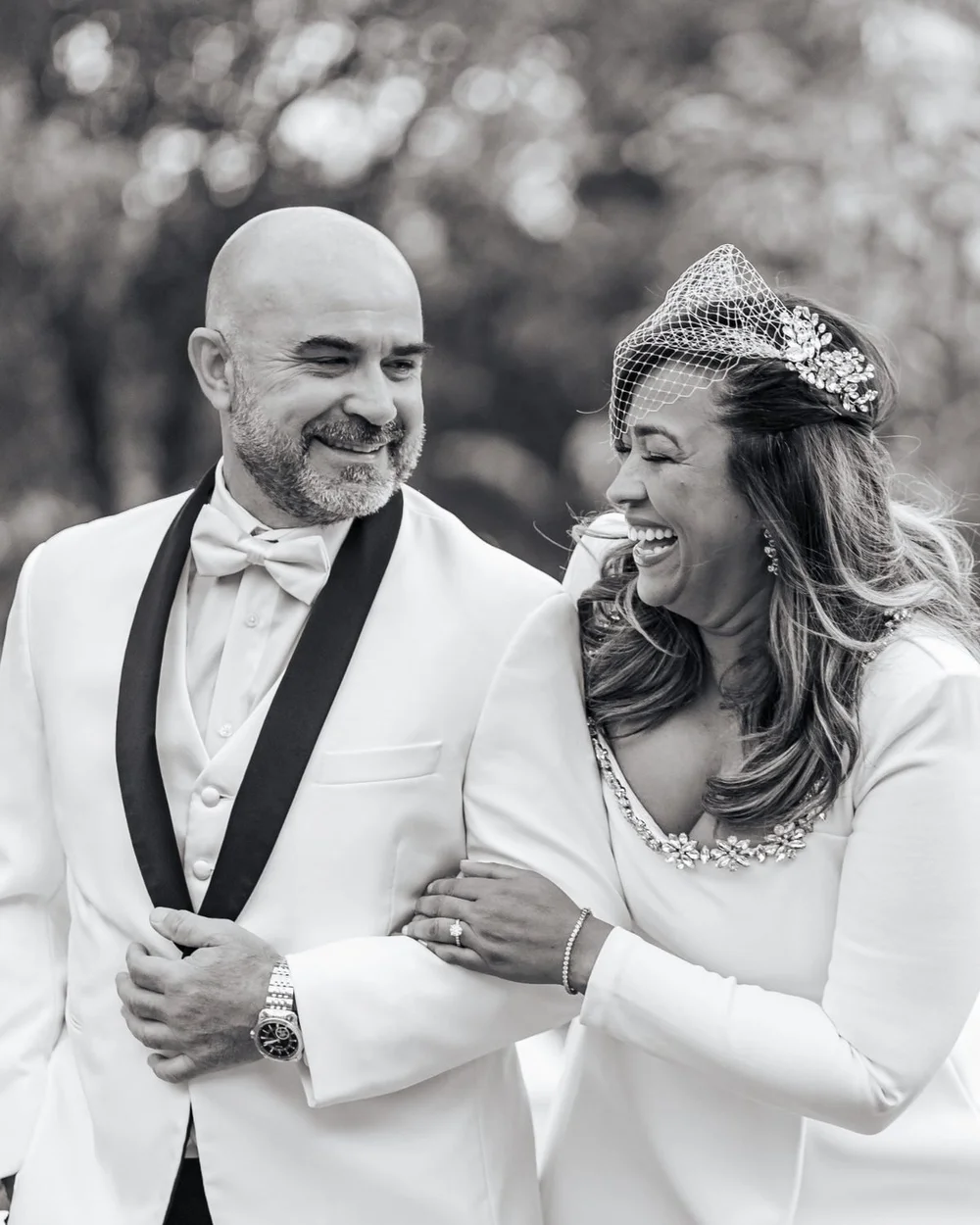 Lissette and Jack laugh arm in arm at Mindowaskin Park in Westfield, NJ