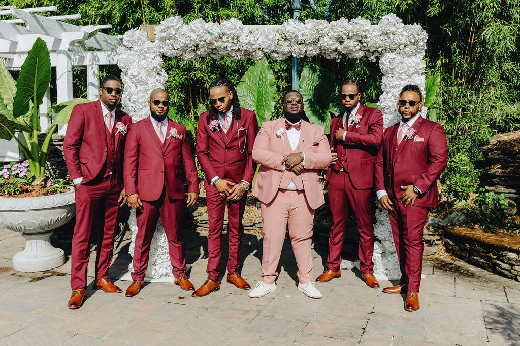 Gillon with his groomsmen in the gardens at Sand Castle in Franklin Square, NY