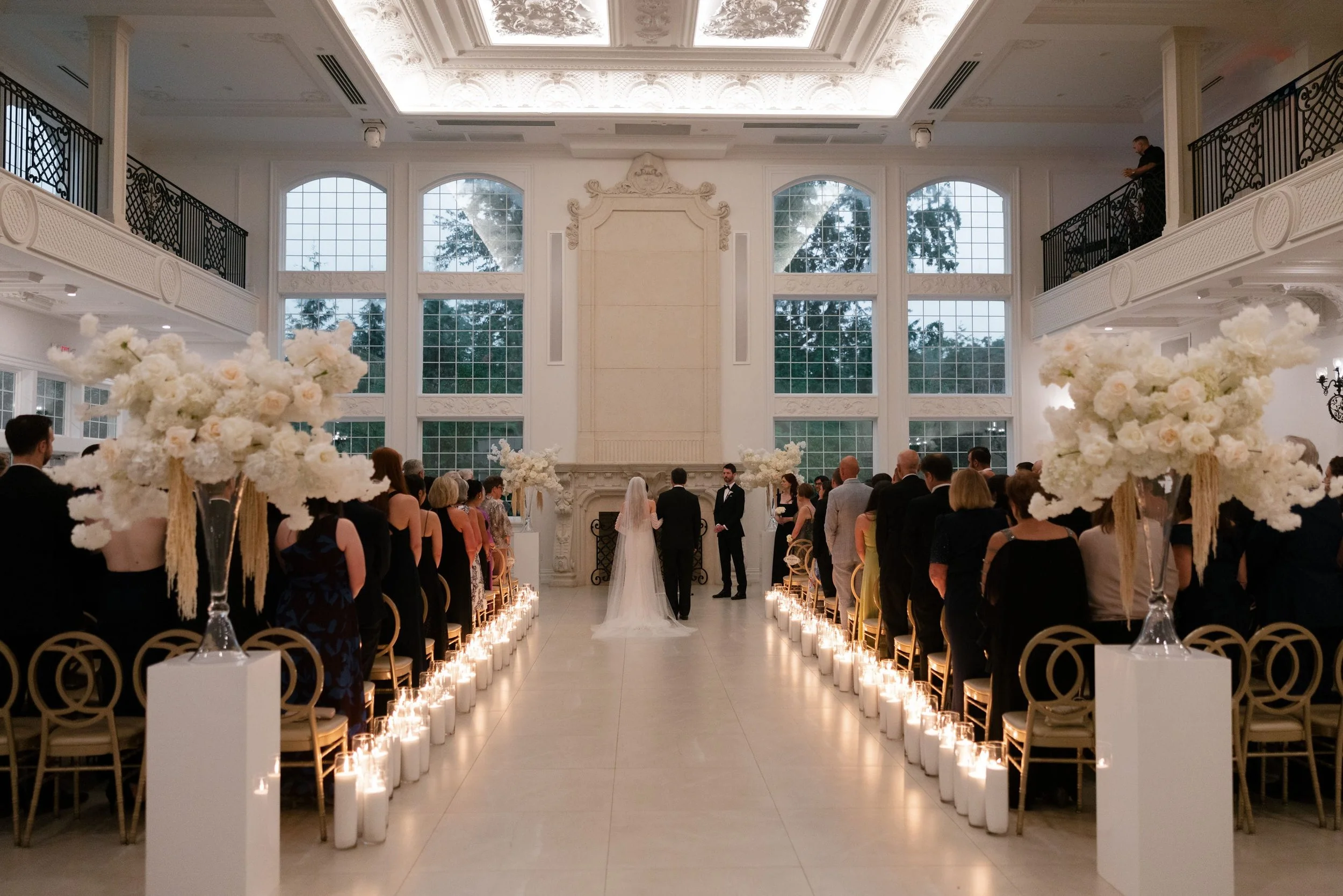 Aerial view of Caroline and her father at the altar before the handoff during her Florentine Gardens wedding ceremony