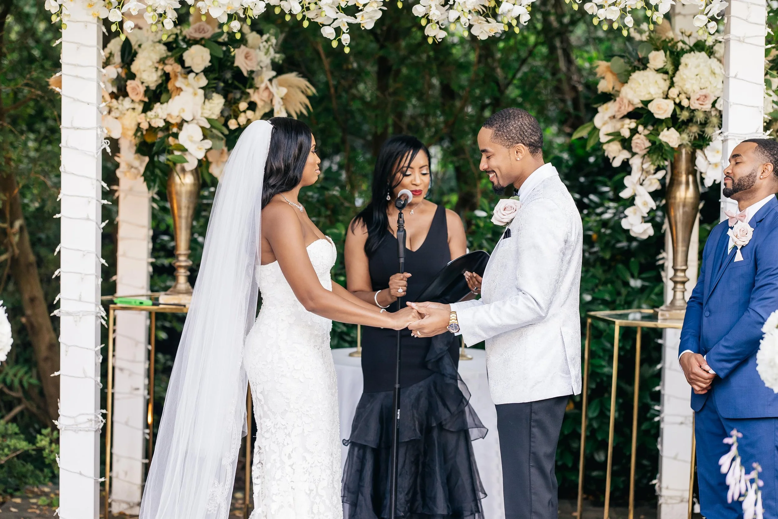 Officiant guiding a couple through their vow exchange at The Fox Hollow in Woodbury, New York