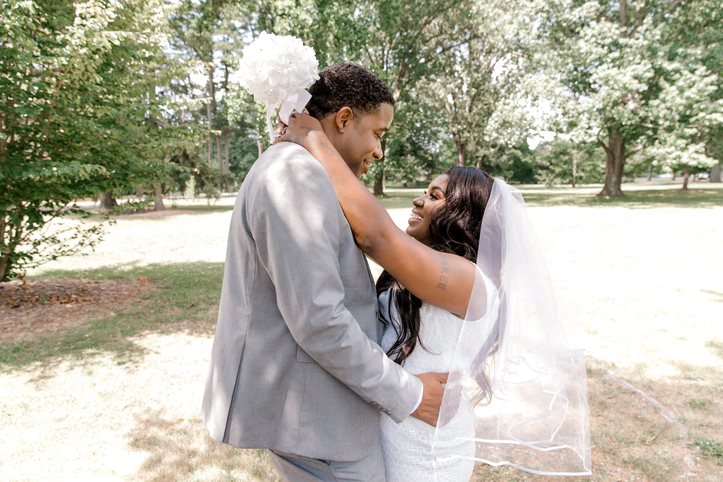 Newlywed couple embracing after their intimate garden elopement at Colonial Park Gardens in Somerset, New Jersey.