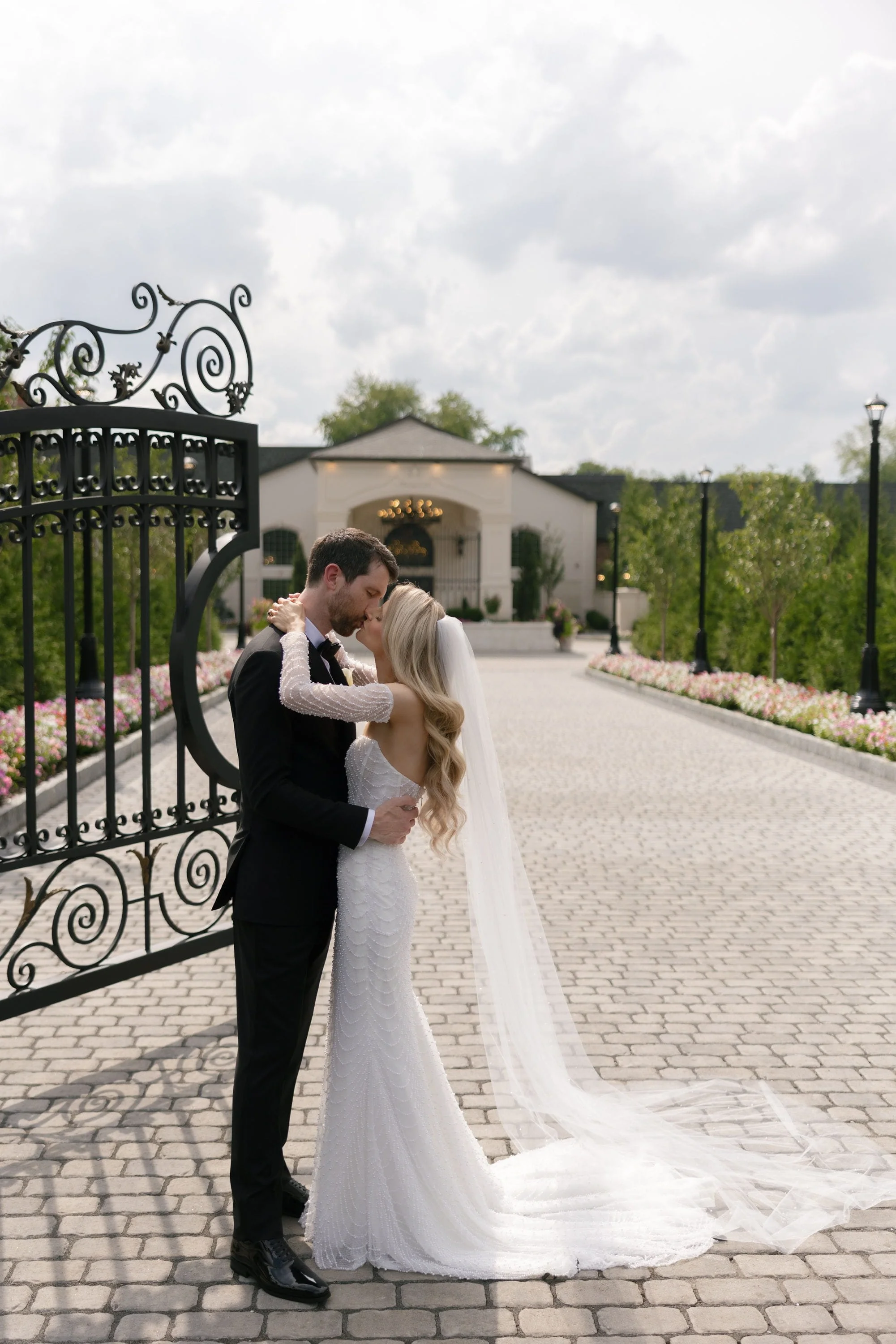 Caroline and Brett kissing at the entrance to Florentine Gardens in River Vale, NJ