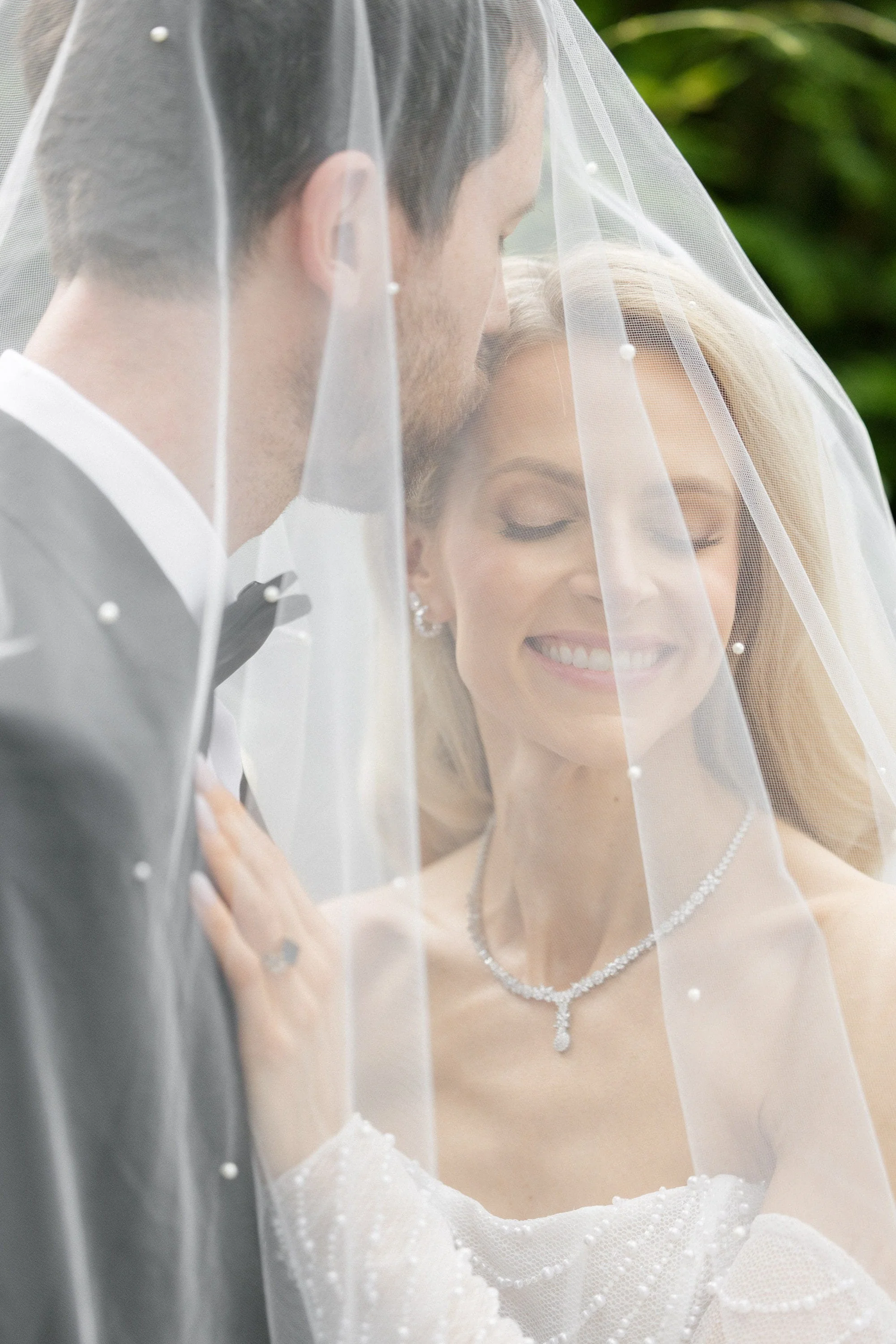Bride and groom posing in the gardens at their luxury wedding at The Estate at Florentine Gardens in River Vale, New Jersey