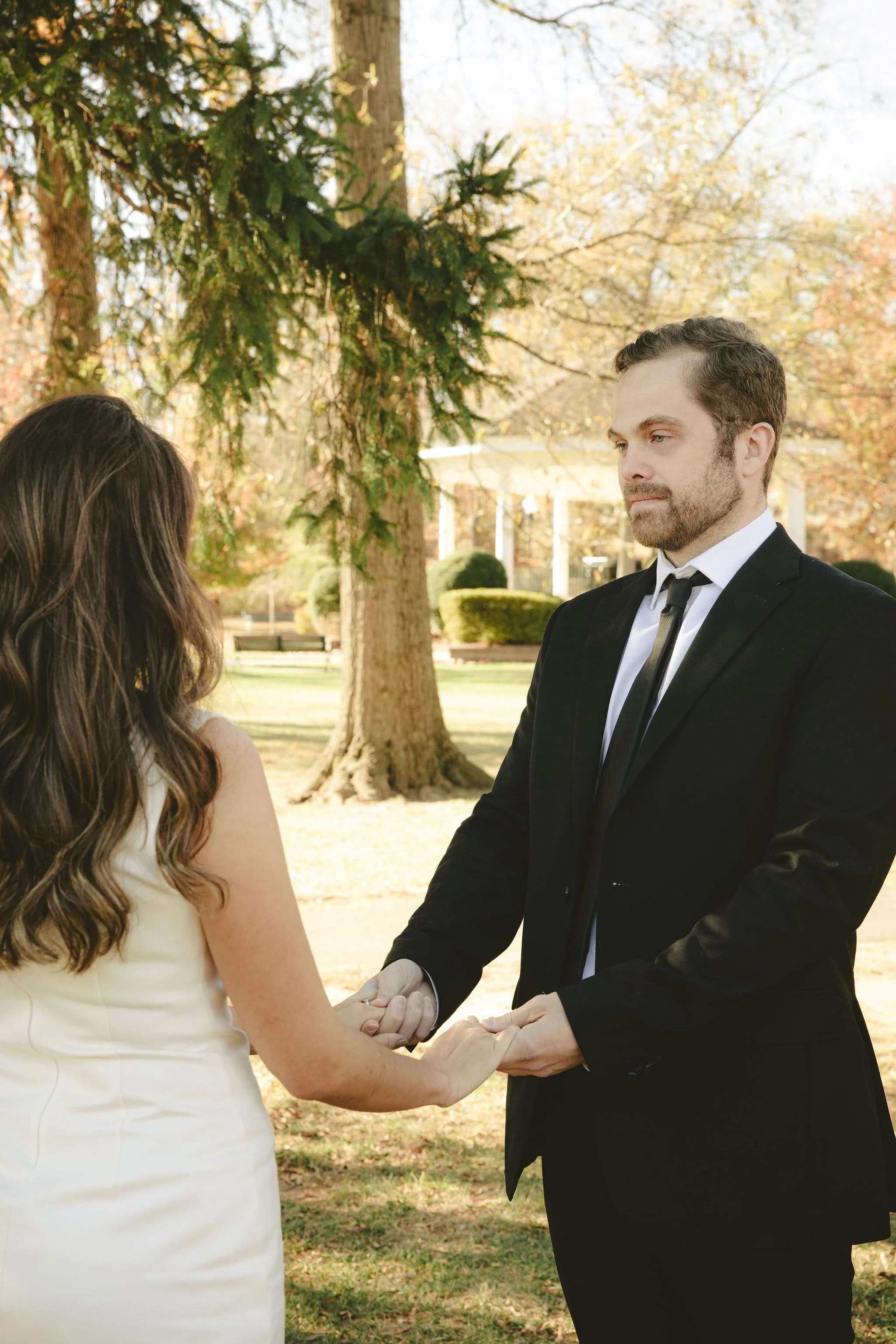 Outdoor elopement ceremony in Monmouth County, New Jersey with couple exchanging vows during an intimate wedding