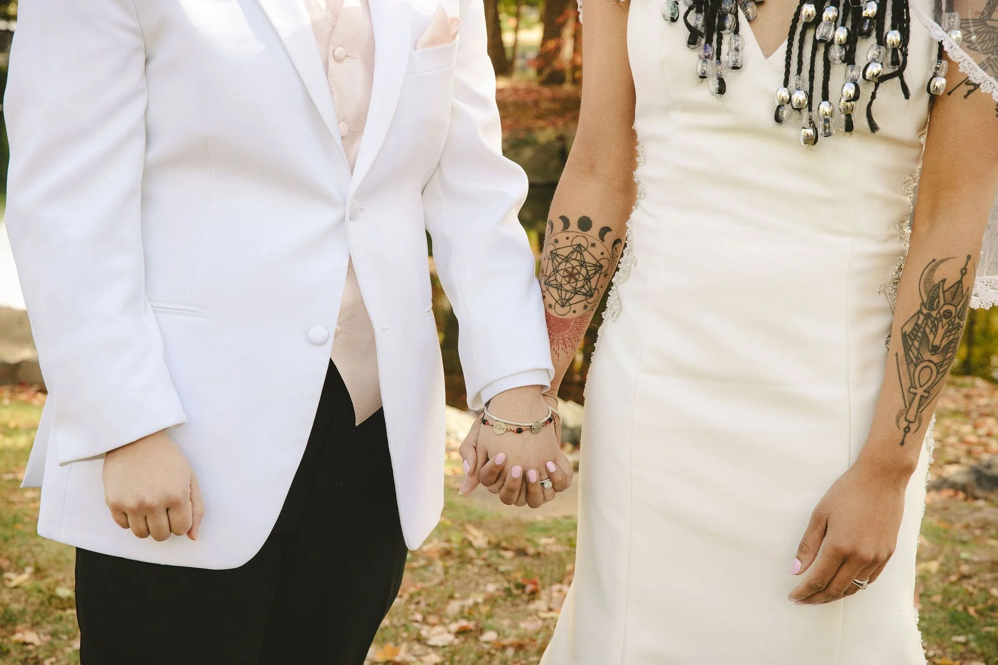 Couple holding hands during an intimate elopement in Mercer County, New Jersey.
