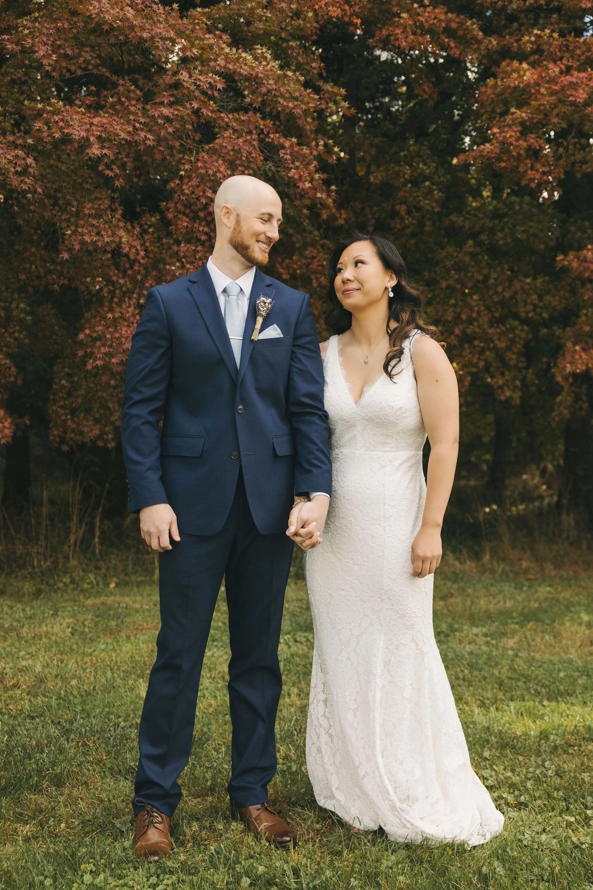 Newly married couple standing together during an outdoor elopement in Hunterdon County, New Jersey