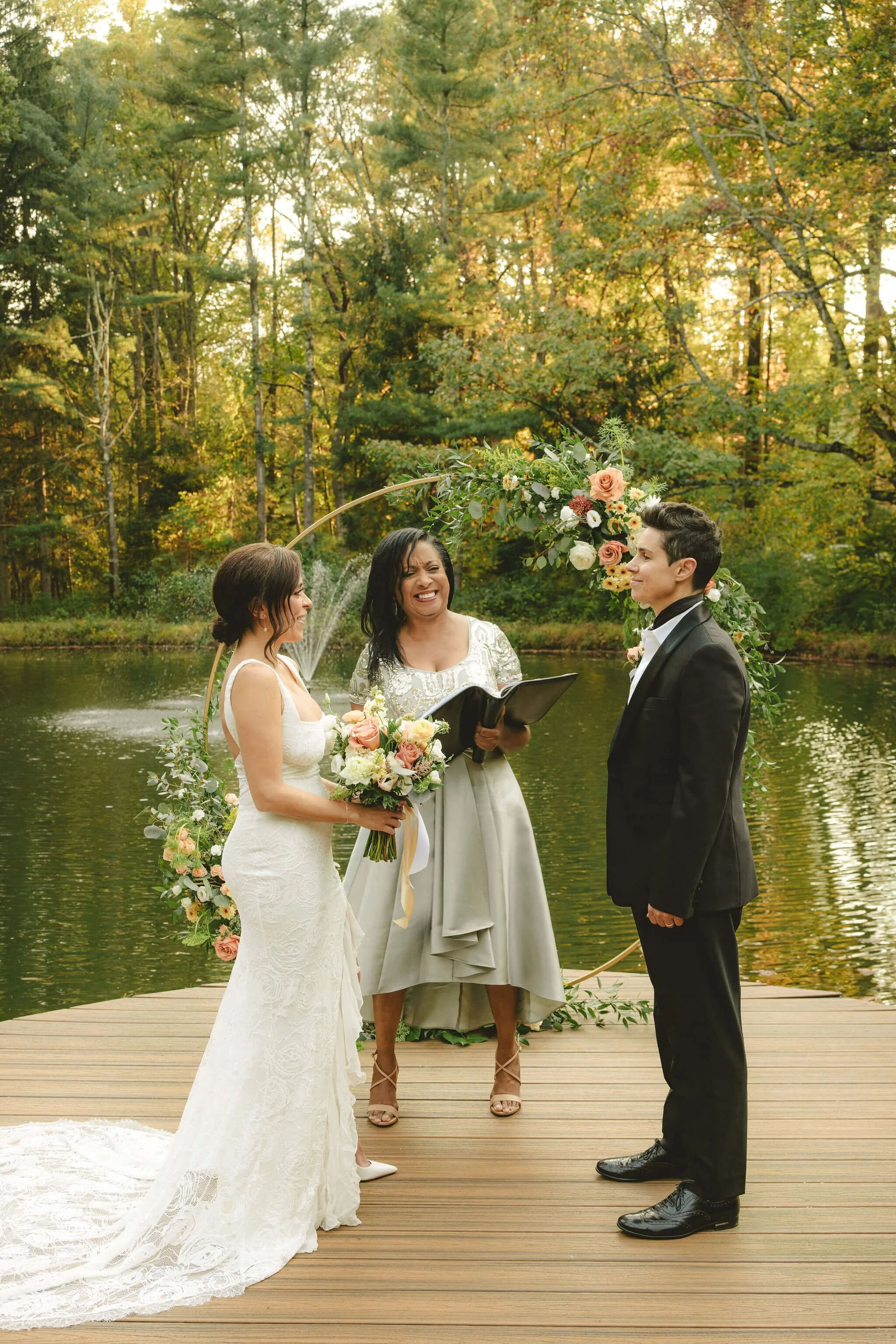 Two brides exchange vows during an intimate elopement ceremony in New Jersey officiated by Weddings By Aretha.