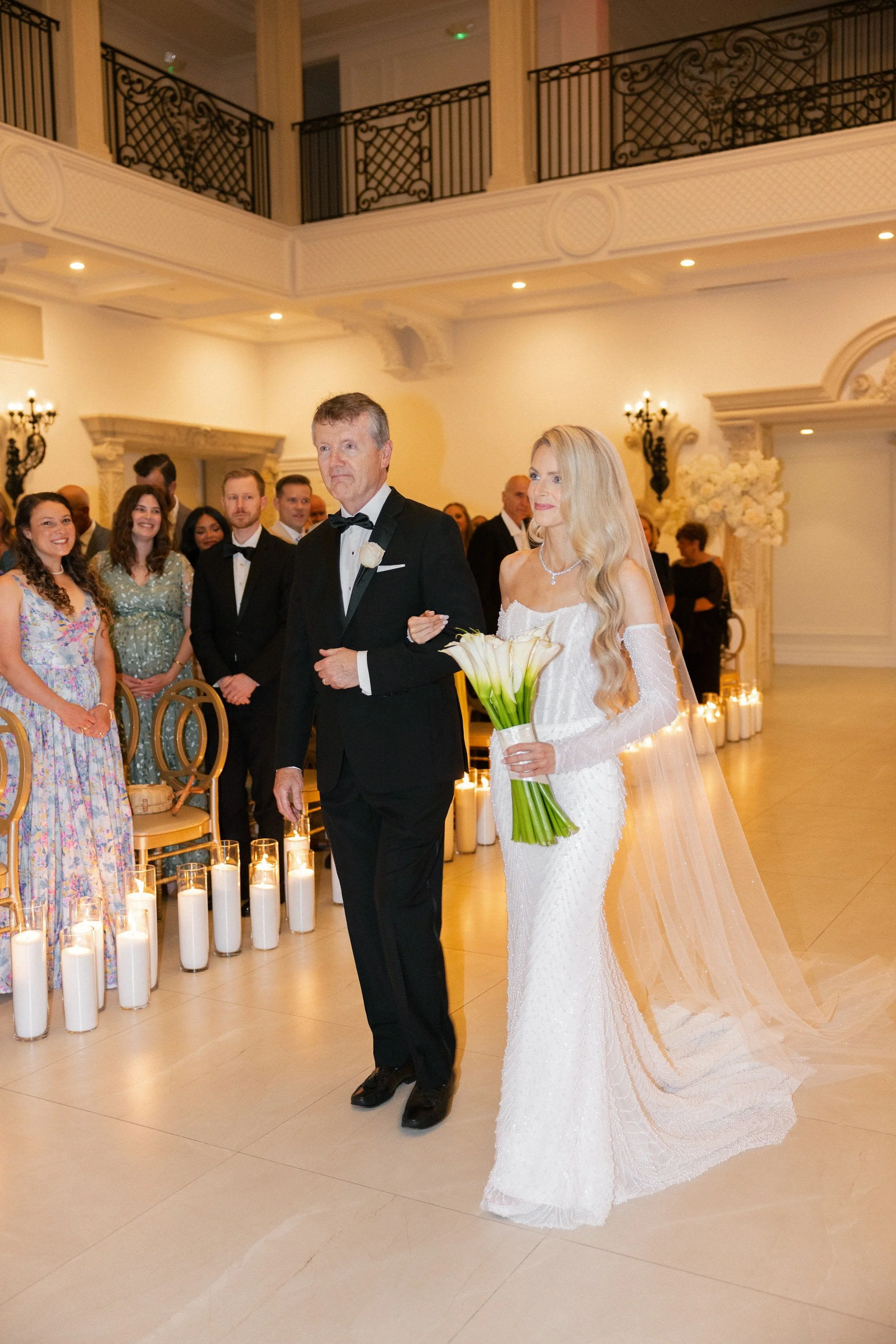 Caroline walking down the aisle with her father during her wedding ceremony at Florentine Gardens in River Vale, NJ