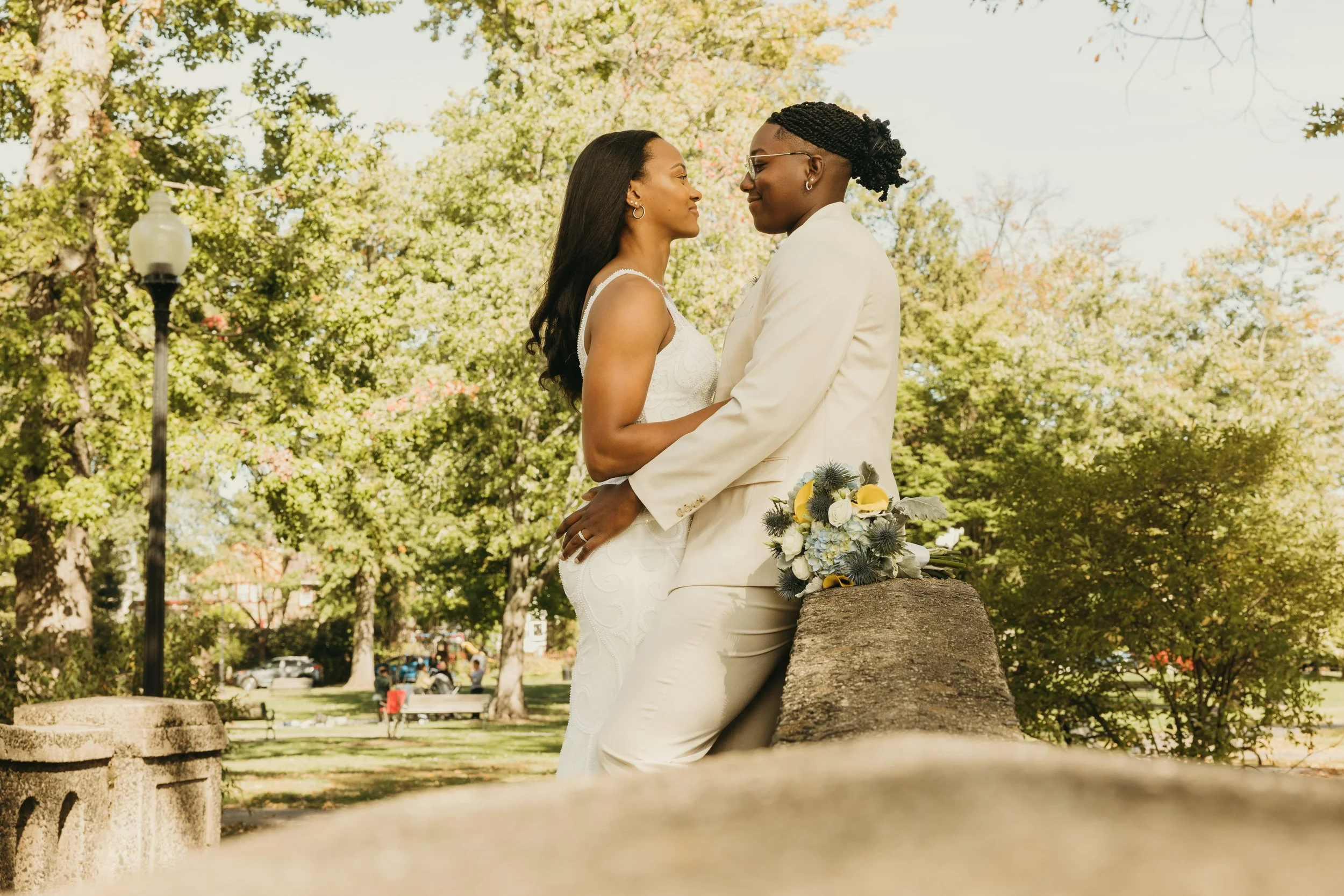Jaide and Amiaya embrace and look at each other during their wedding portraits at Mindowaskin Park in Westfield, NJ.