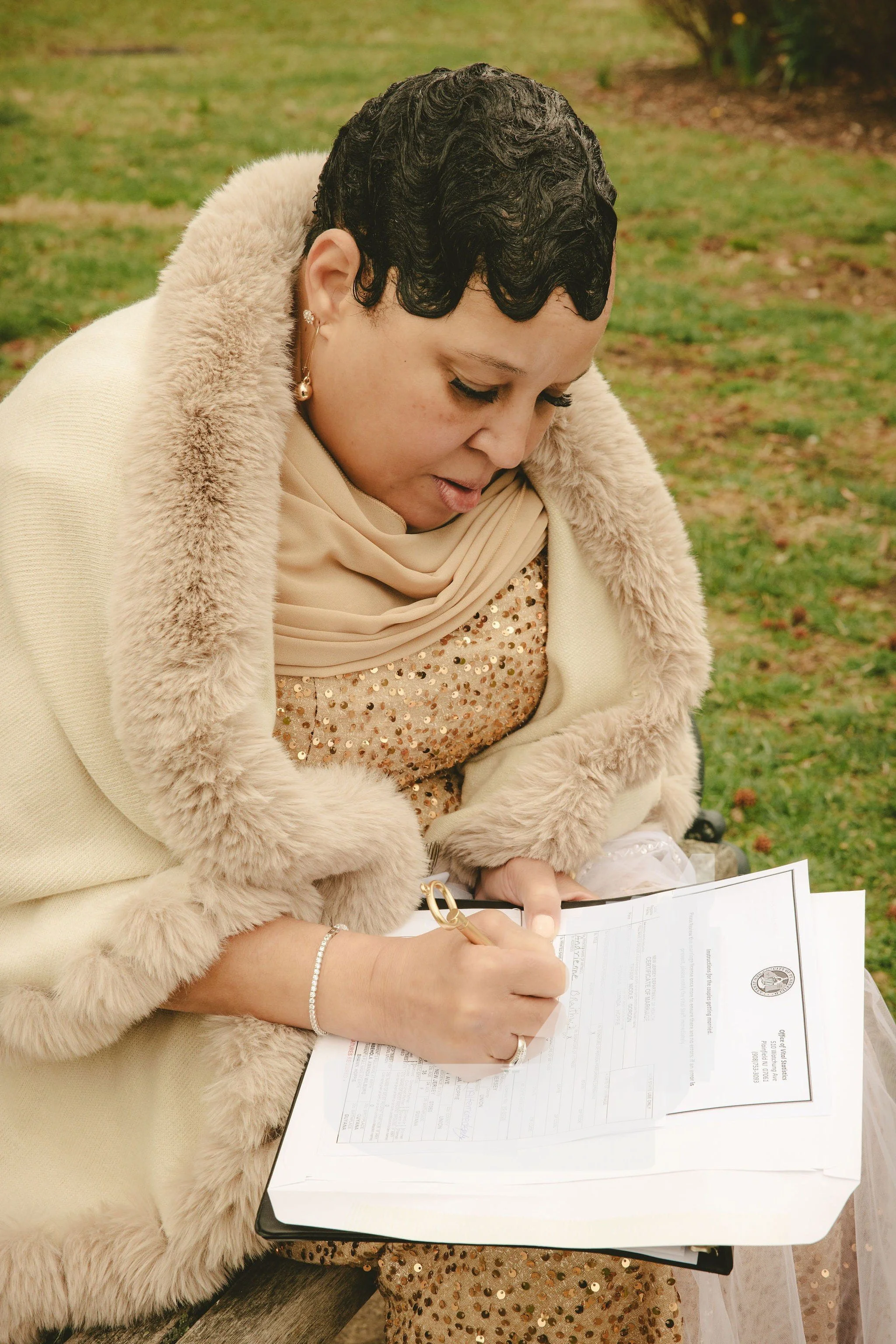 Witness signing a New Jersey marriage license after an elopement at Mindowaskin Park in Westfield, NJ