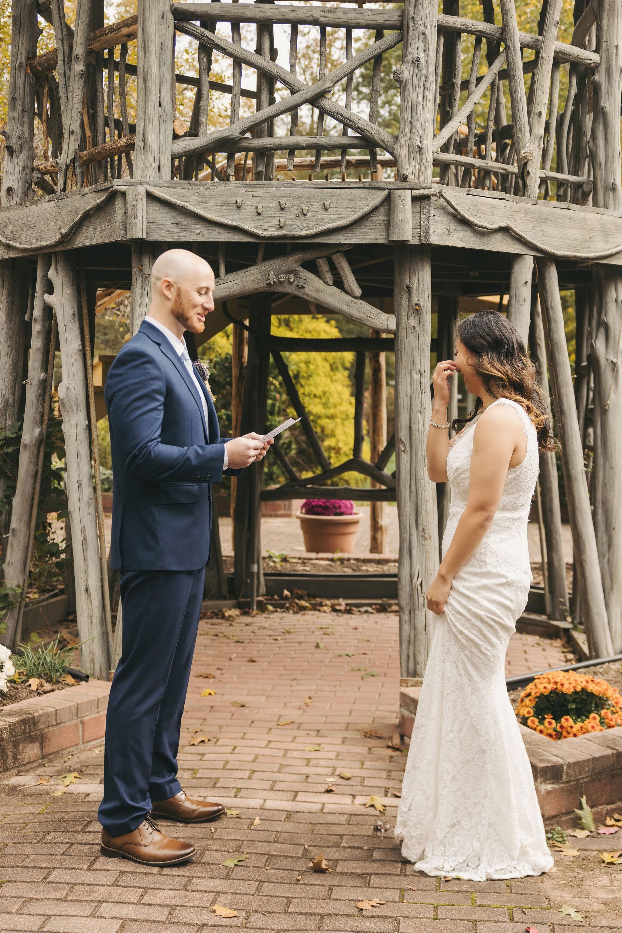 Private outdoor elopement ceremony in Hunterdon County, New Jersey with couple exchanging vows