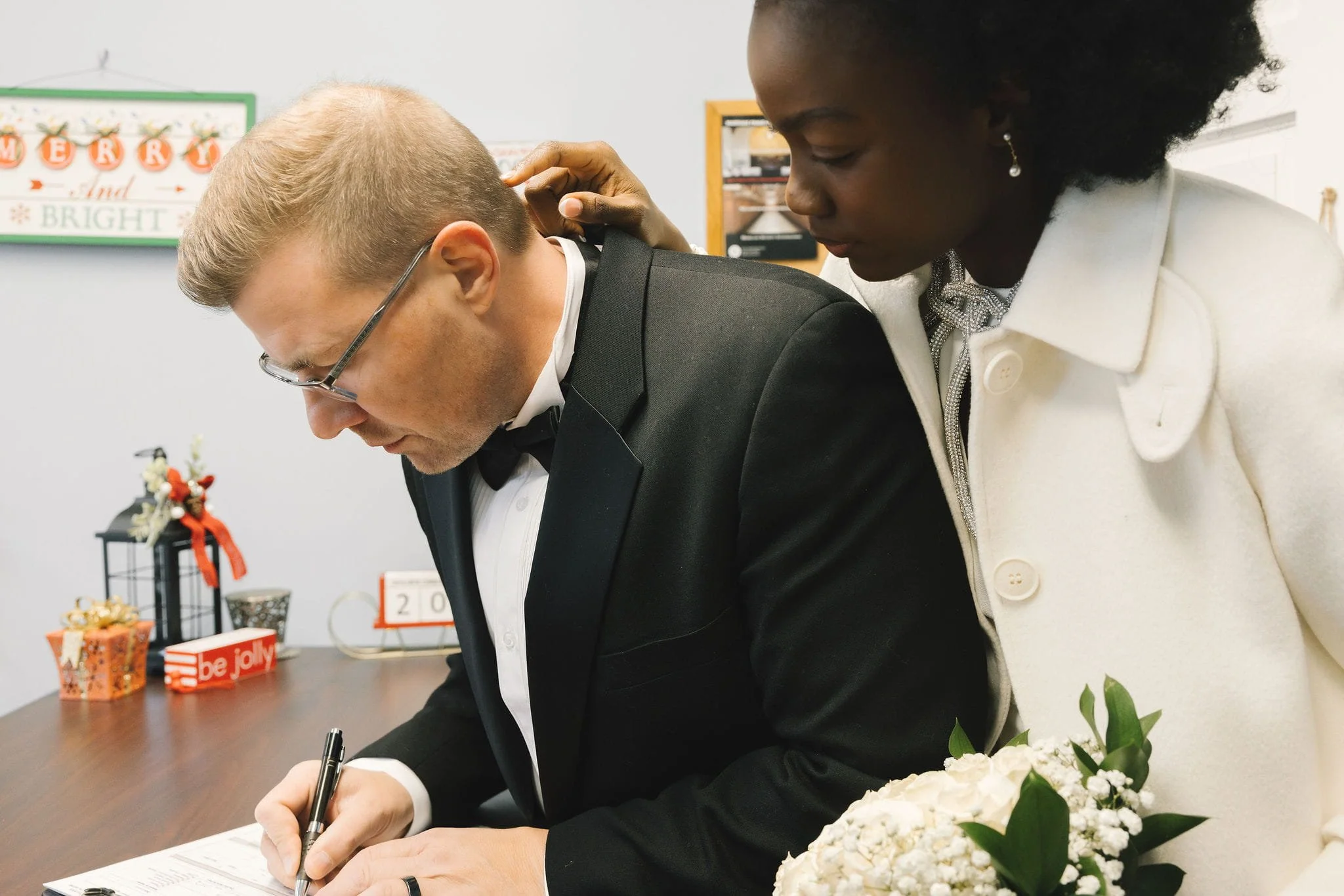 Newlywed couple completing marriage paperwork for their Certified Marriage Certificate in Westfield, New Jersey.