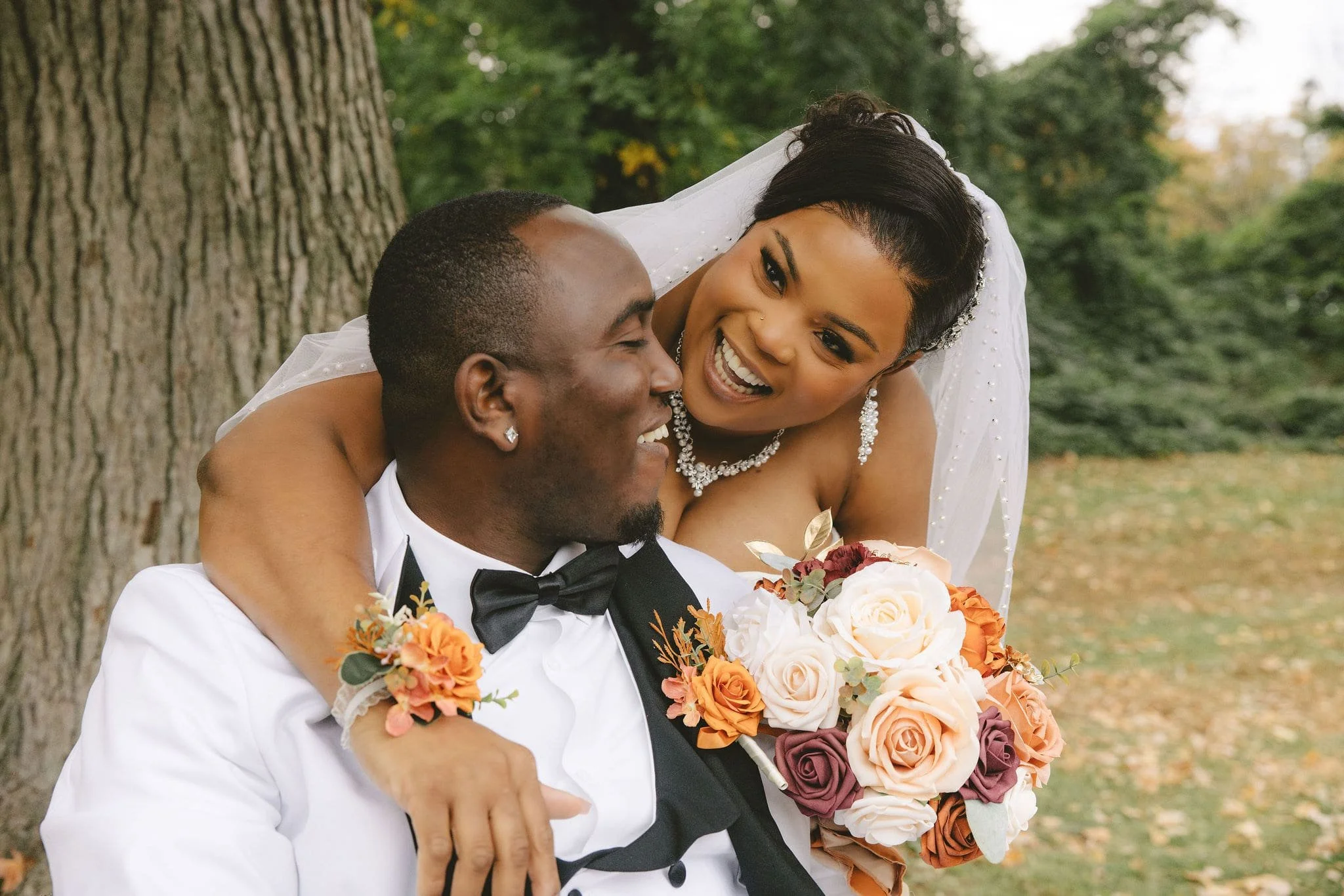 Joyful Union County elopement couple sharing a candid moment during their intimate outdoor ceremony