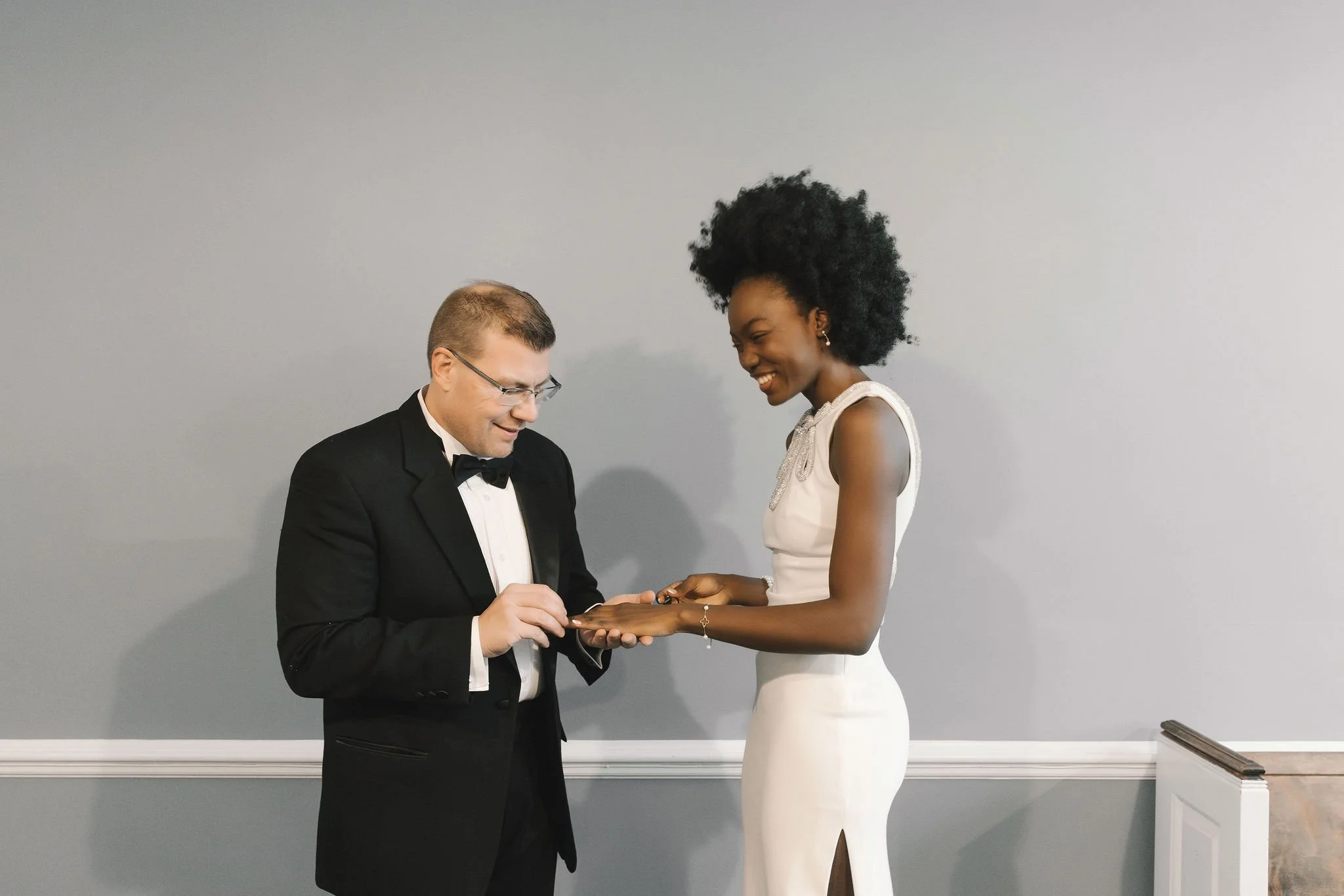 Intimate indoor elopement ceremony in Bergen County, New Jersey with a couple exchanging rings