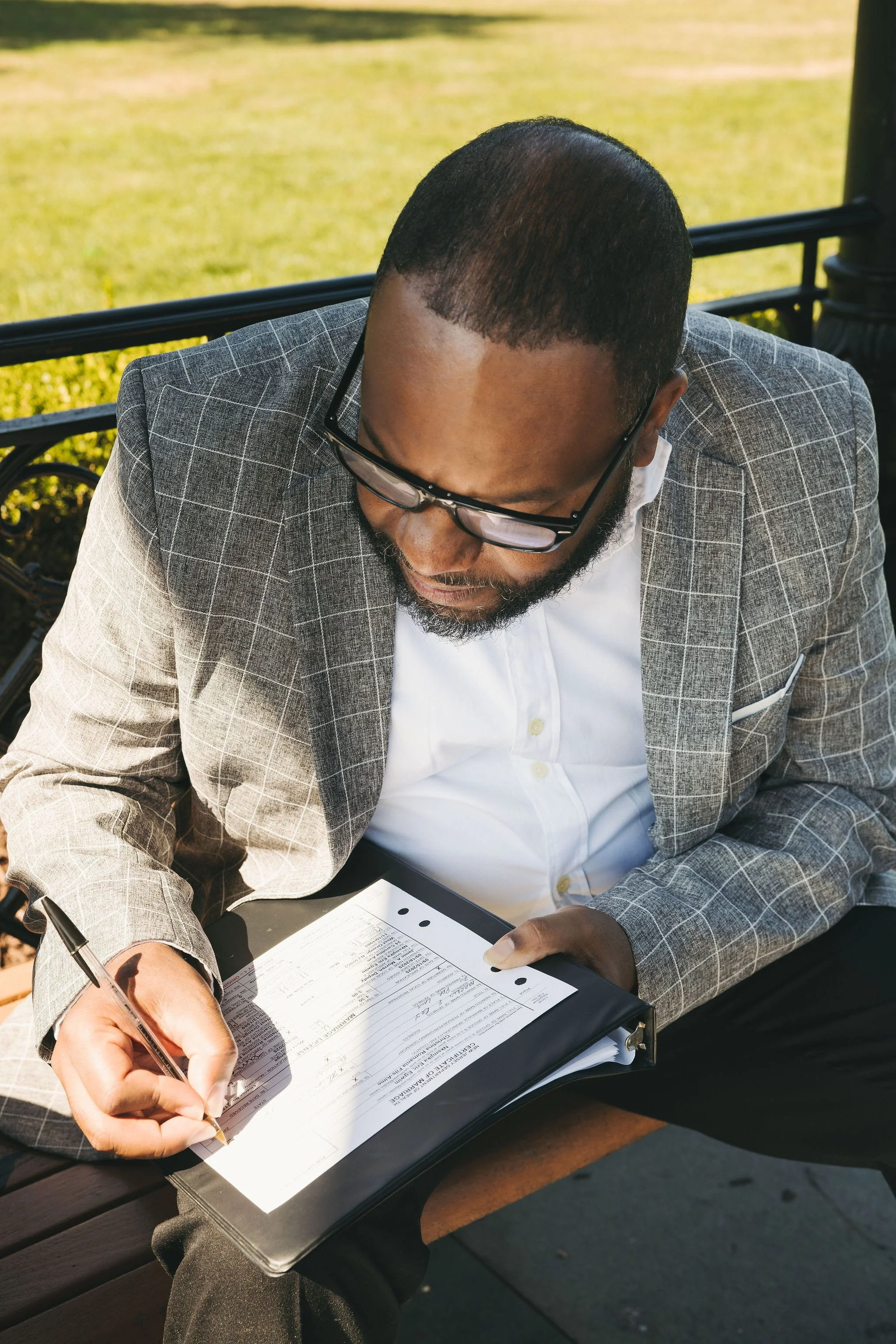 Witness signing a marriage license for a private New Jersey elopement ceremony.