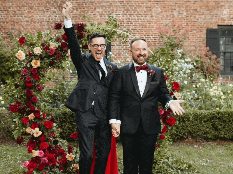 Aretha Gaskin officiates an LGBT wedding at Senate Garage in Kingston, NY. The couple celebrates their marriage with a fist raised