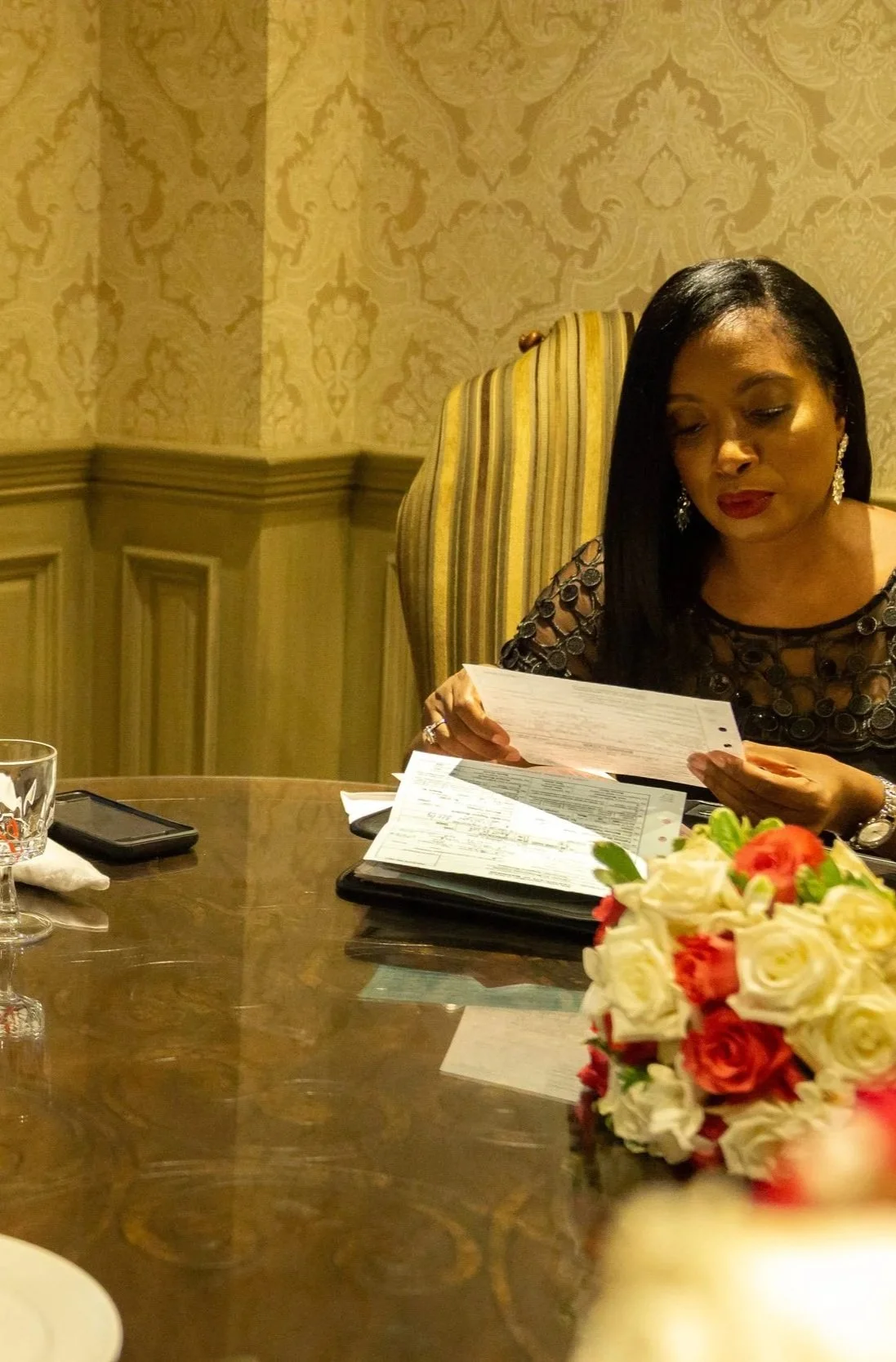 New Jersey wedding officiant reviewing a completed marriage license with a couple in Garfield, New Jersey