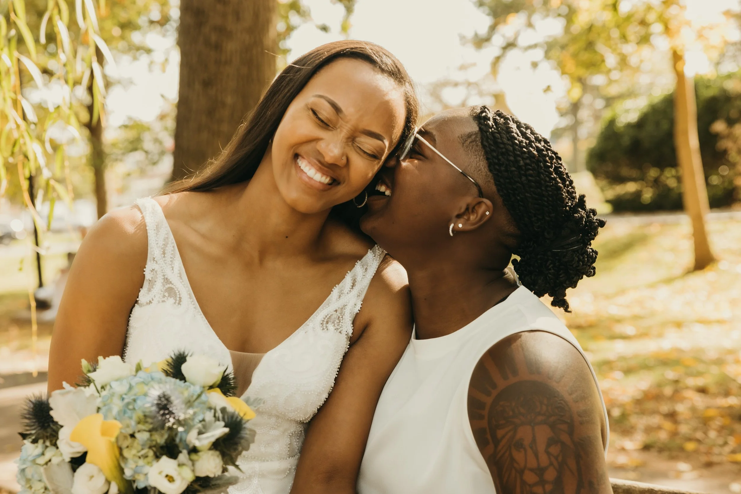 Jaide and Amiaya sharing a playful moment during their elopement portraits at Mindowaskin Park in Westfield, NJ.