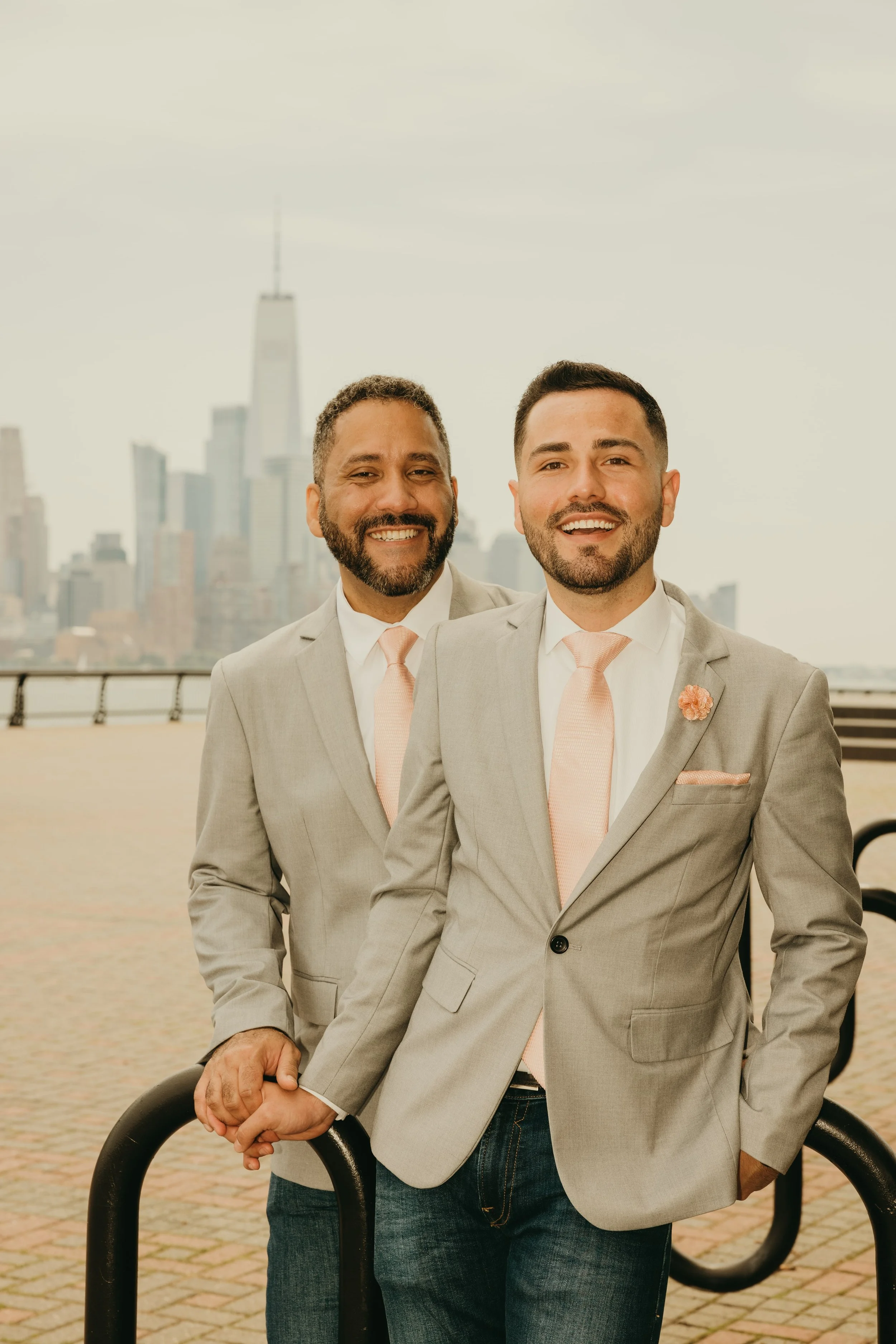 LGBT couple celebrating their Hoboken, New Jersey elopement with the NYC skyline in the background.