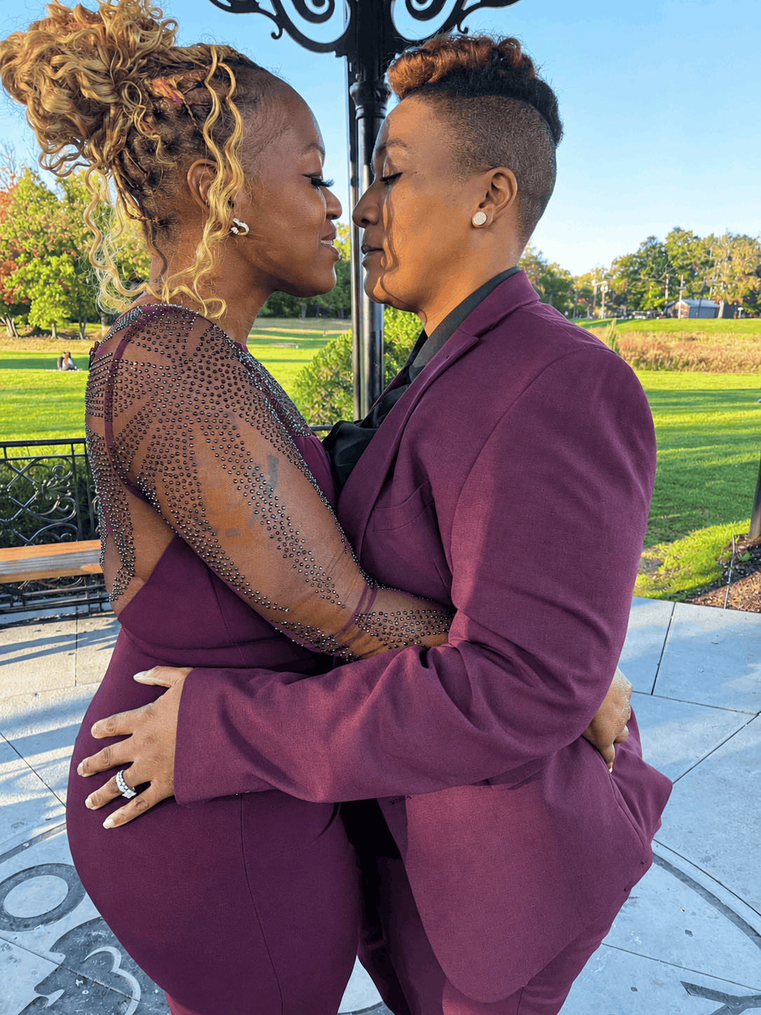 Two brides, Tiffany and Tanell, embracing at Eagle Rock Reservation in West Orange, NJ during their intimate wedding ceremony.