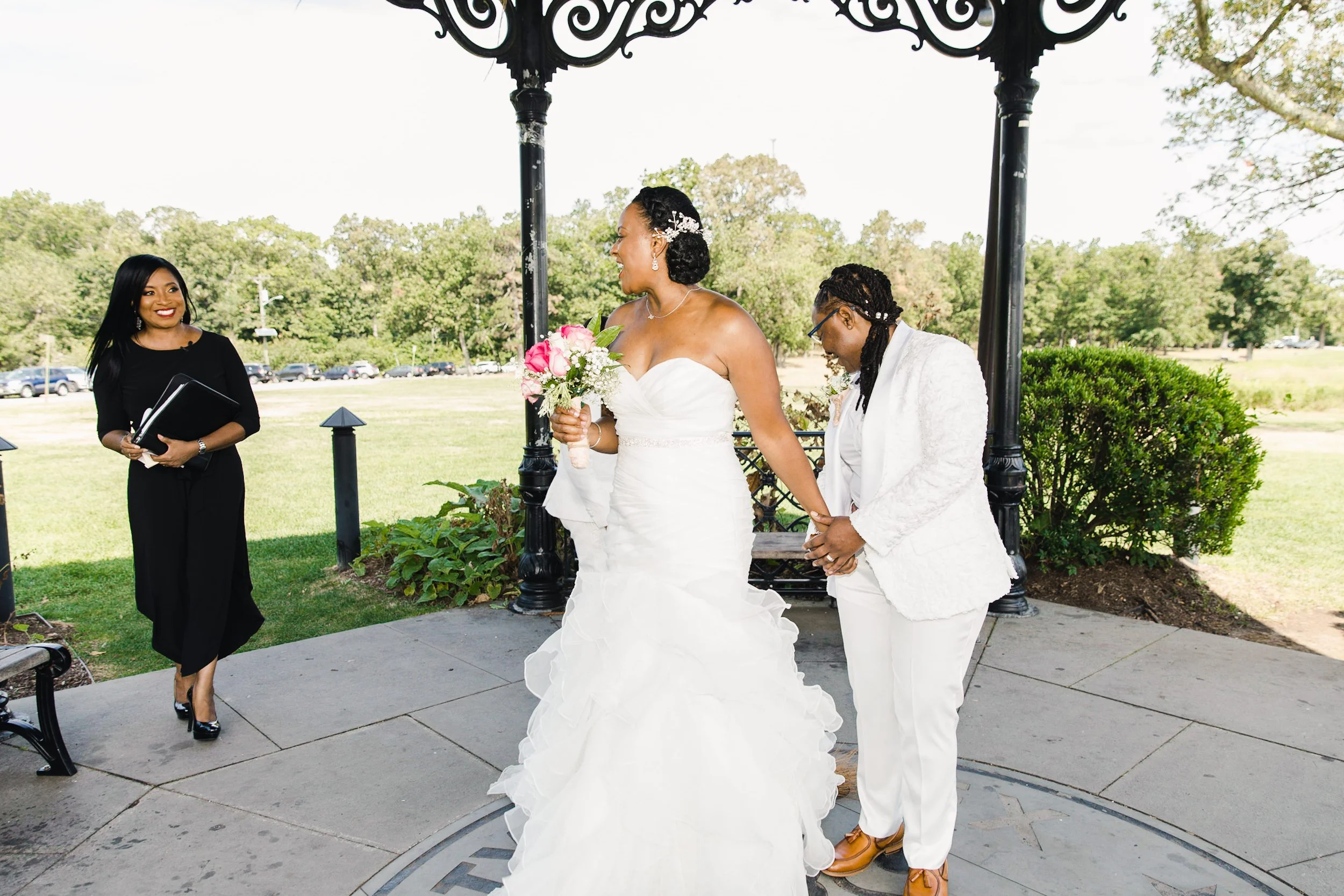 Luciana and Tevonda celebrating after jumping the broom during their elopement ceremony at Eagle Rock Reservation.