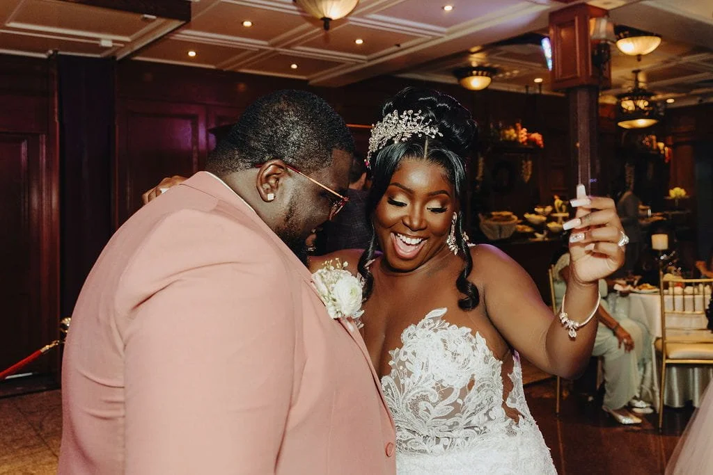 Kristie and Gillon dancing together during their wedding reception at Sand Castle in Franklin Square, NY
