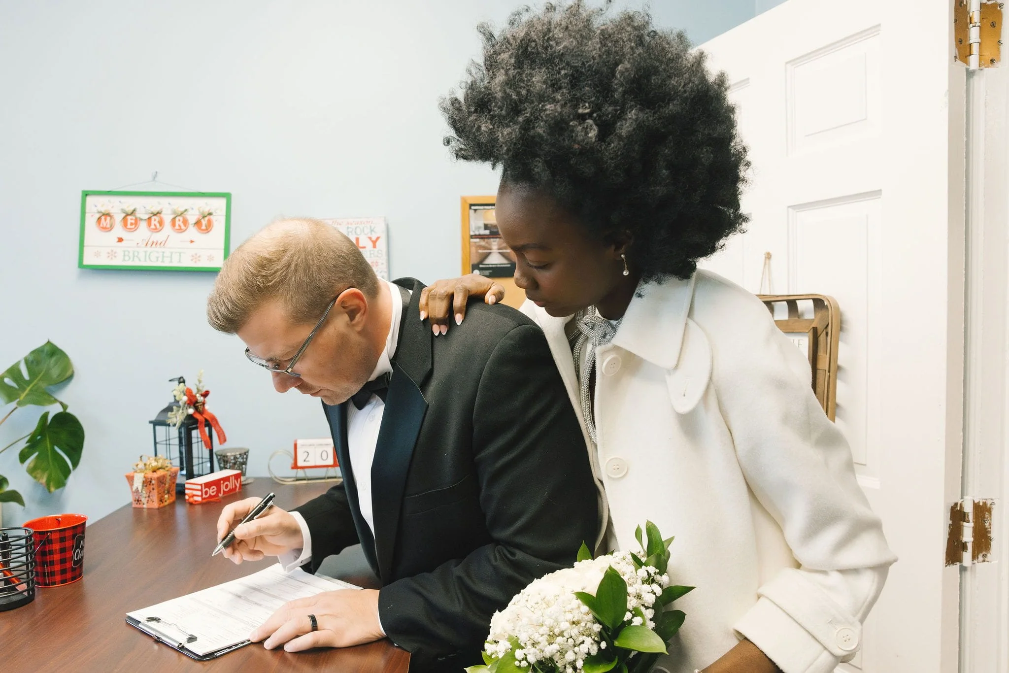 Couple signing their marriage license in Westfield, New Jersey
