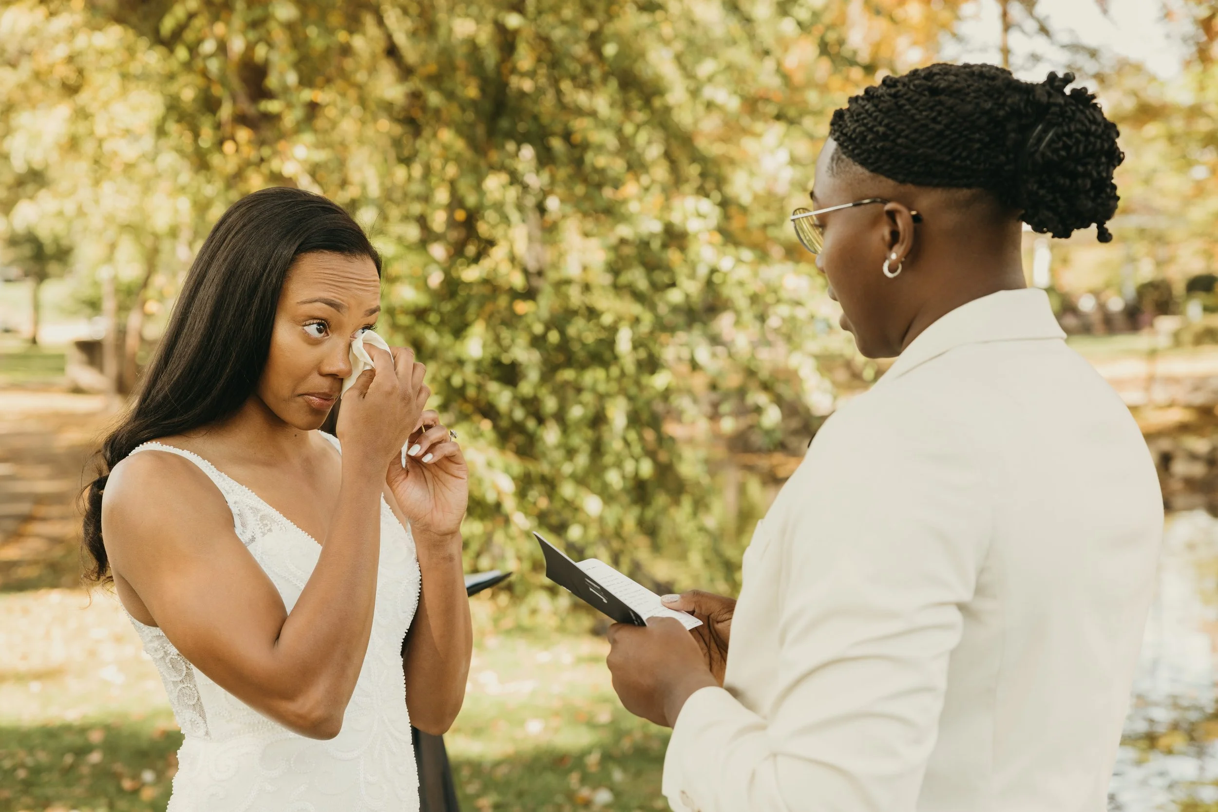 Amiaya wipes away tears as Jaide reads her personalized vows during their intimate Mindowaskin Park elopement in Westfield, NJ.