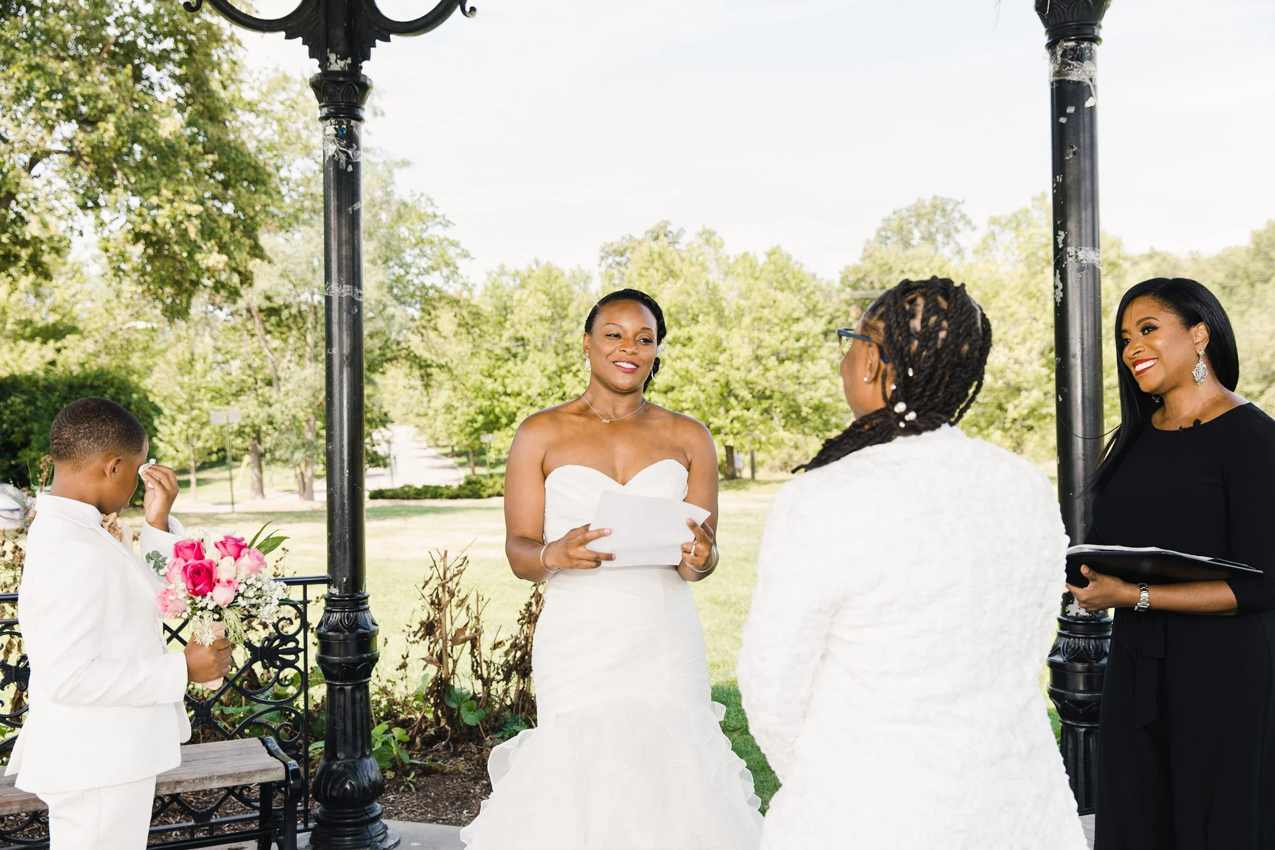 Bride reads her vows during an intimate elopement ceremony with wedding officiant Aretha Gaskin at Eagle Rock Reservation in West Orange, New Jersey.